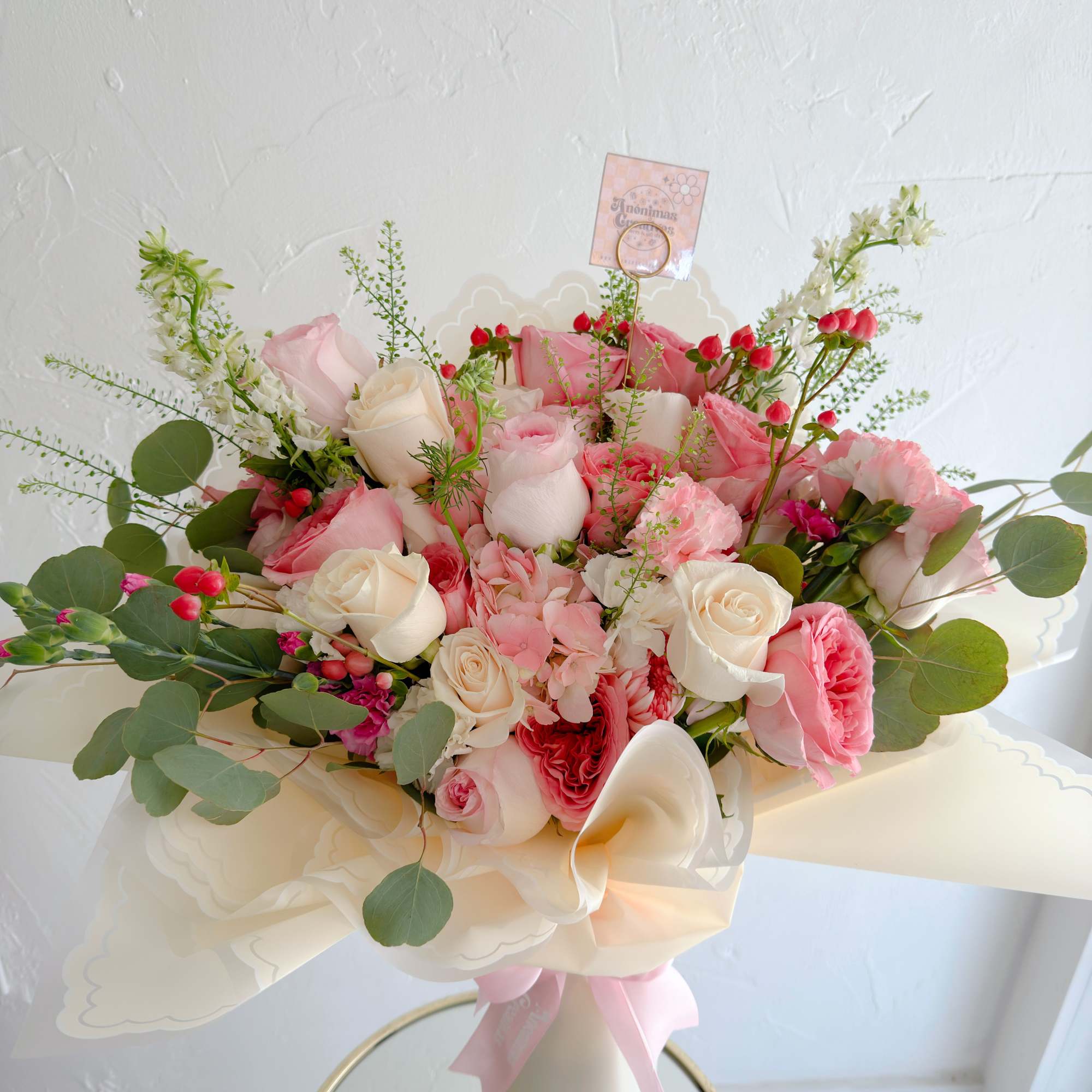 Elegant and romantic bouquet featuring a soft mix of blush and white