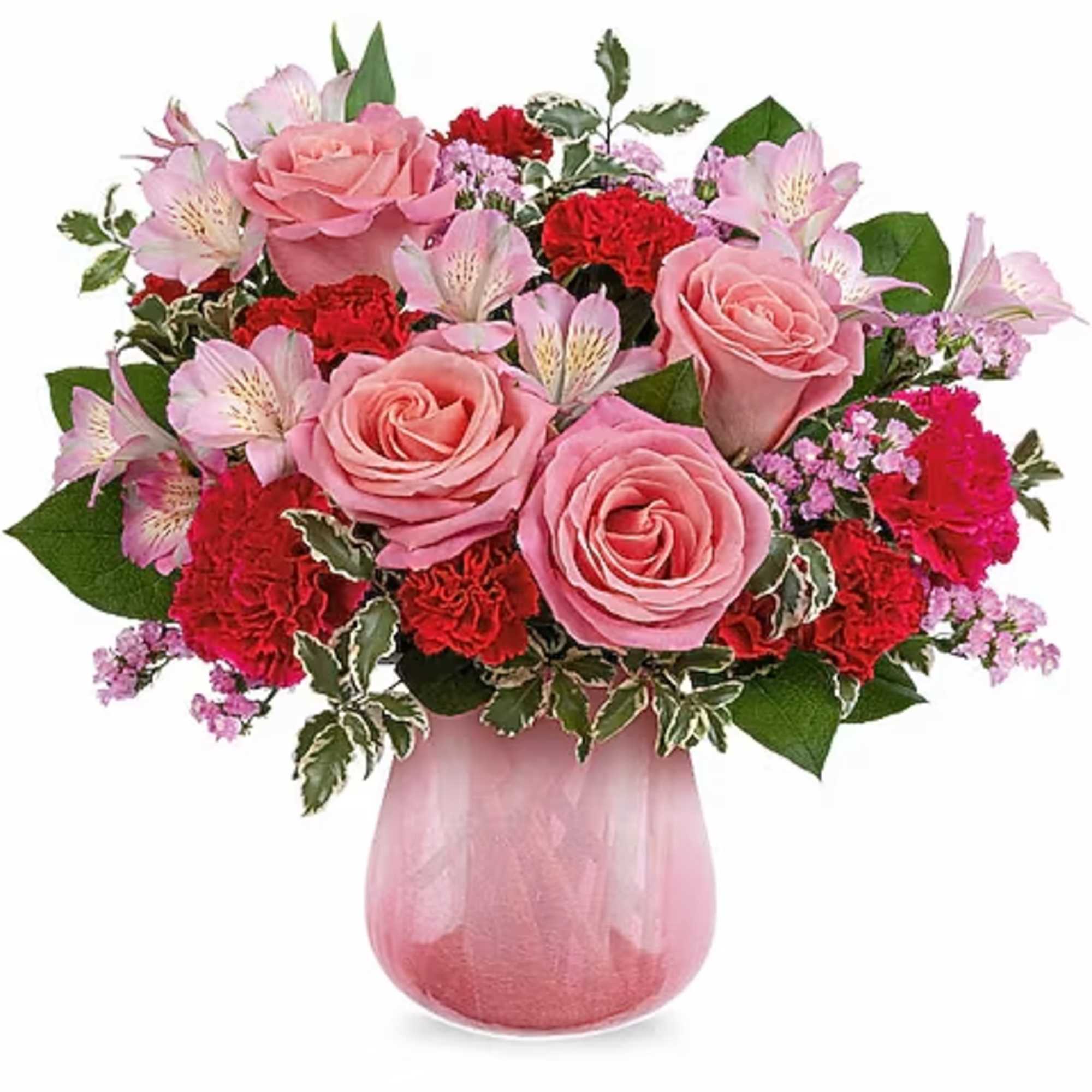 Pink roses and red carnations in a pink glass vase