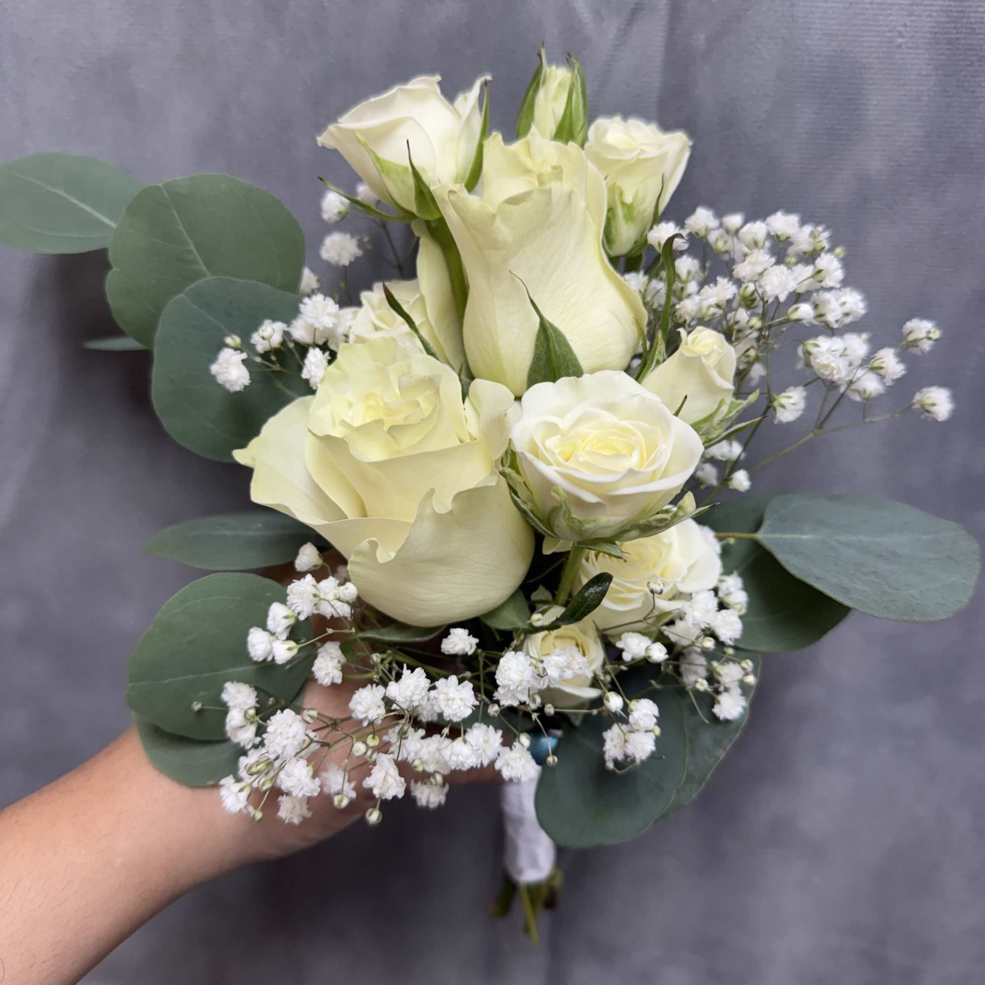 Creamy white roses, spray roses  with baby's breath and eucalyptus; a