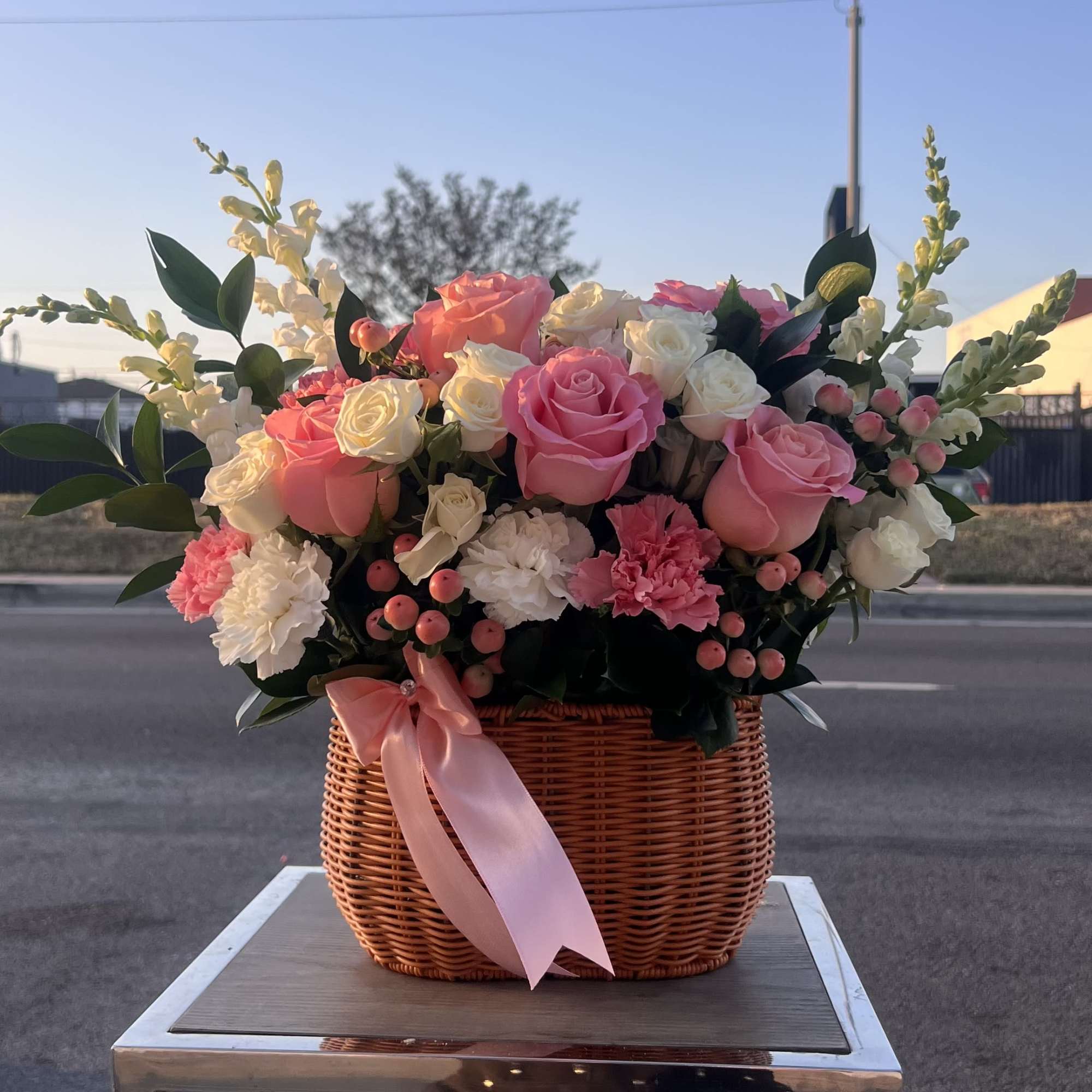 A soft and elegant mix of pink roses and delicate blooms, perfect