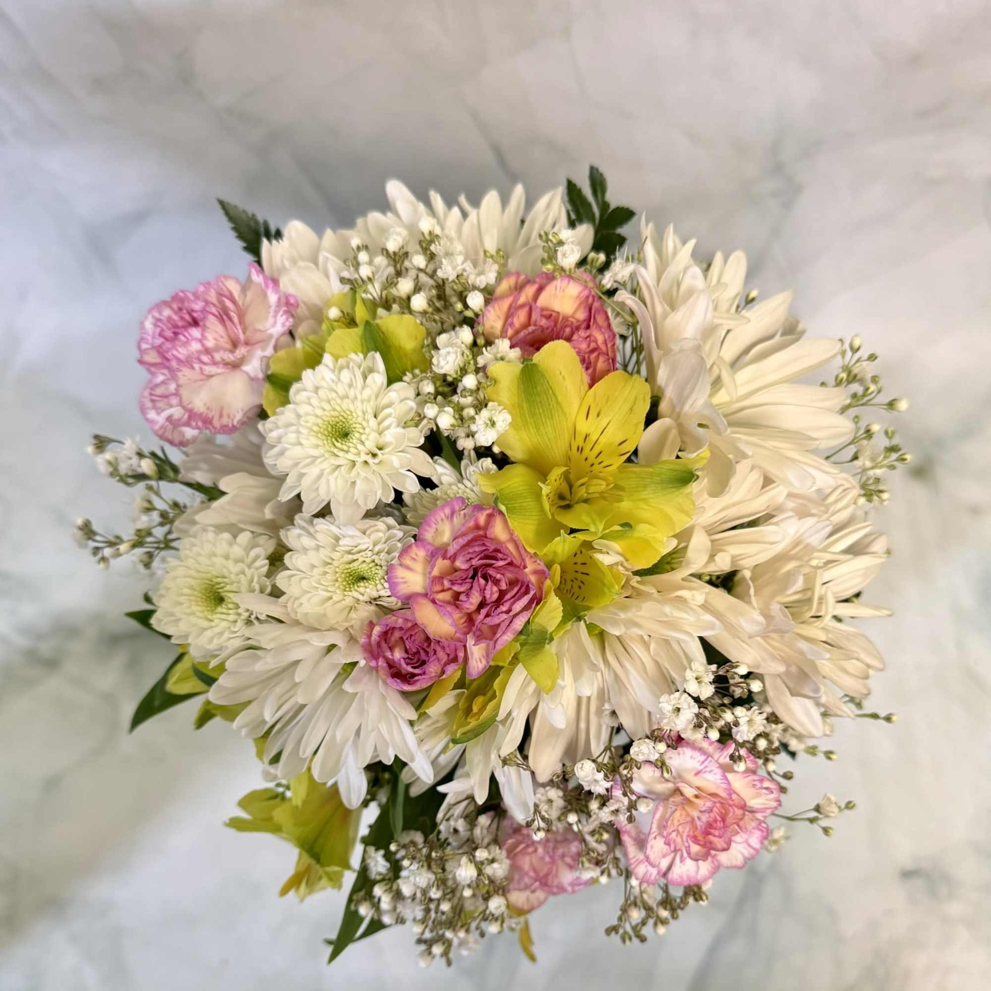 A bright, hand-tied prom bouquet that feels like a pocketful of spring