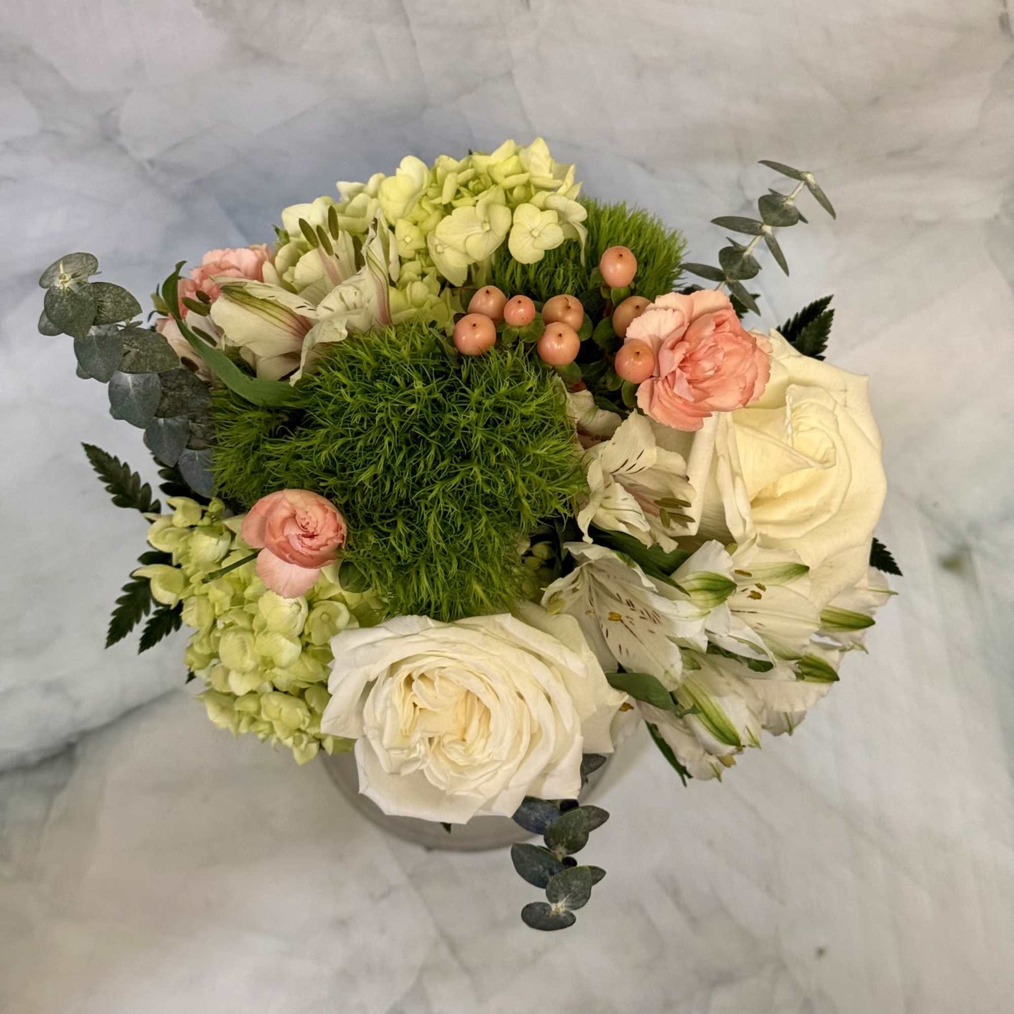 A lush, garden-style prom bouquet that reads as quietly romantic-perfect for prom