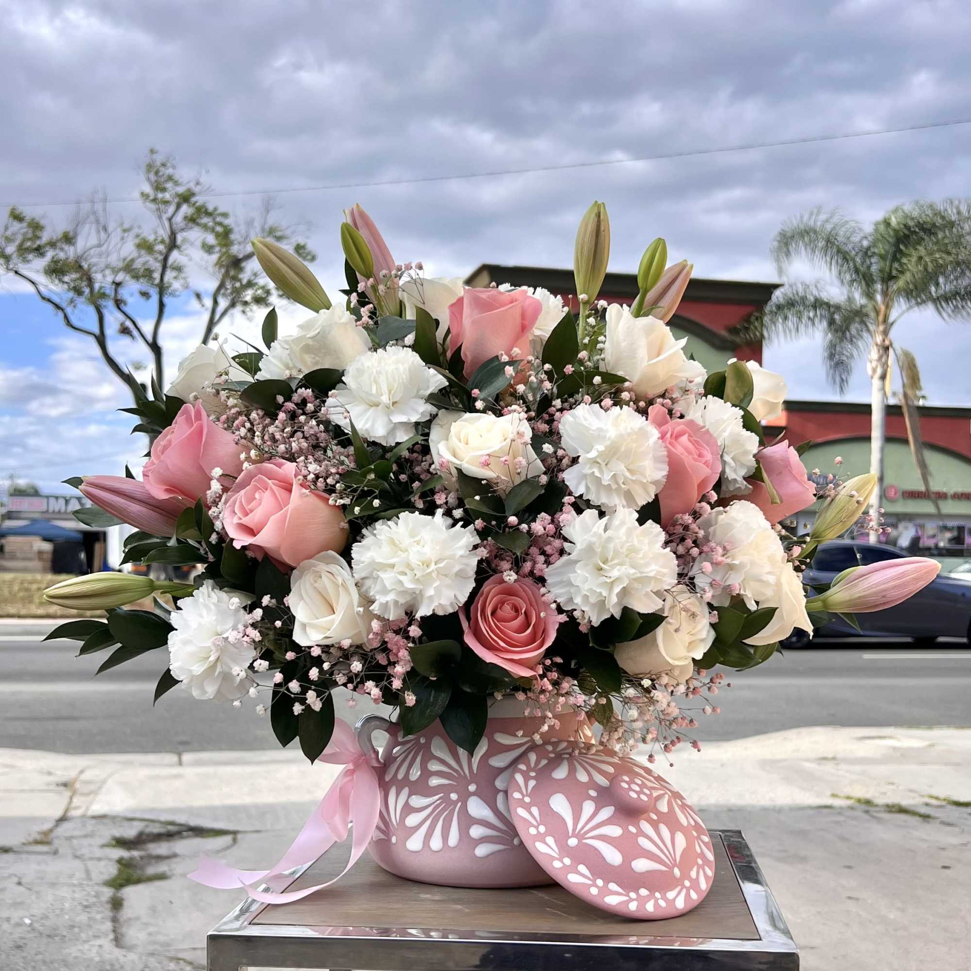 A stunning blend of Pink roses and soft white blooms, perfect for
