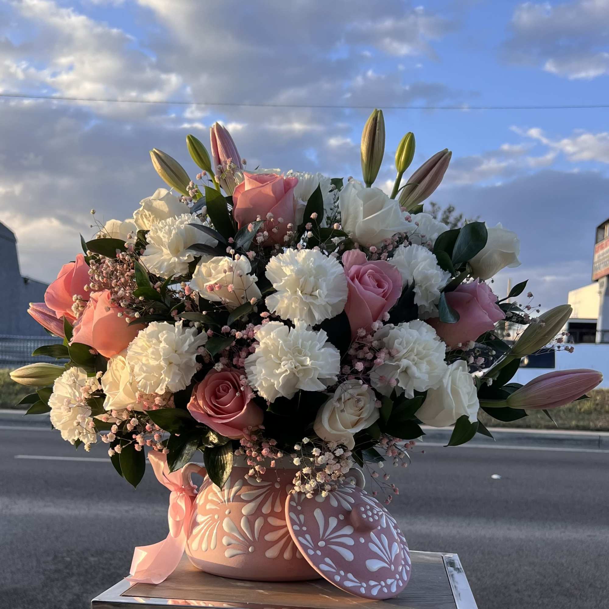 A stunning blend of Pink roses and soft white blooms, perfect for