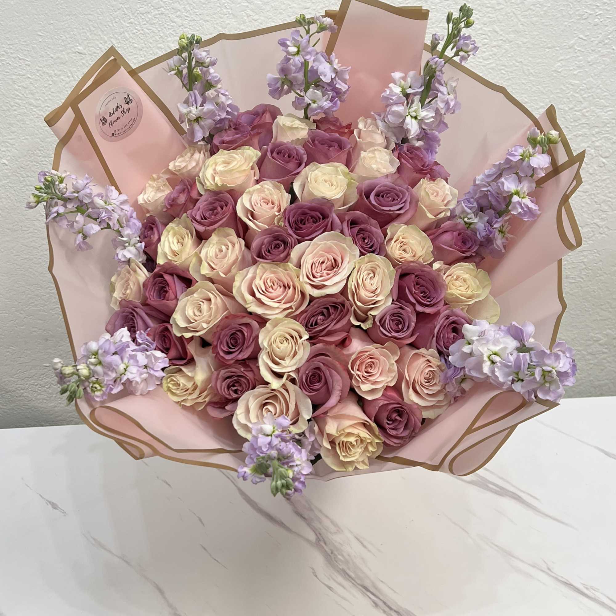 Pink and cream rose bouquet with lavender filler flowers