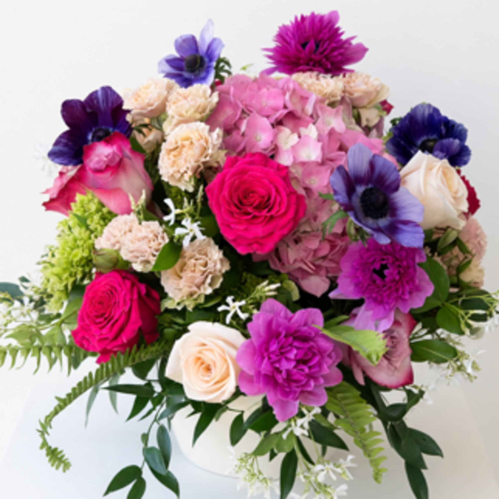 Radiant seasonal blooms arranged with elegance and artistry.
A radiant celebration of color