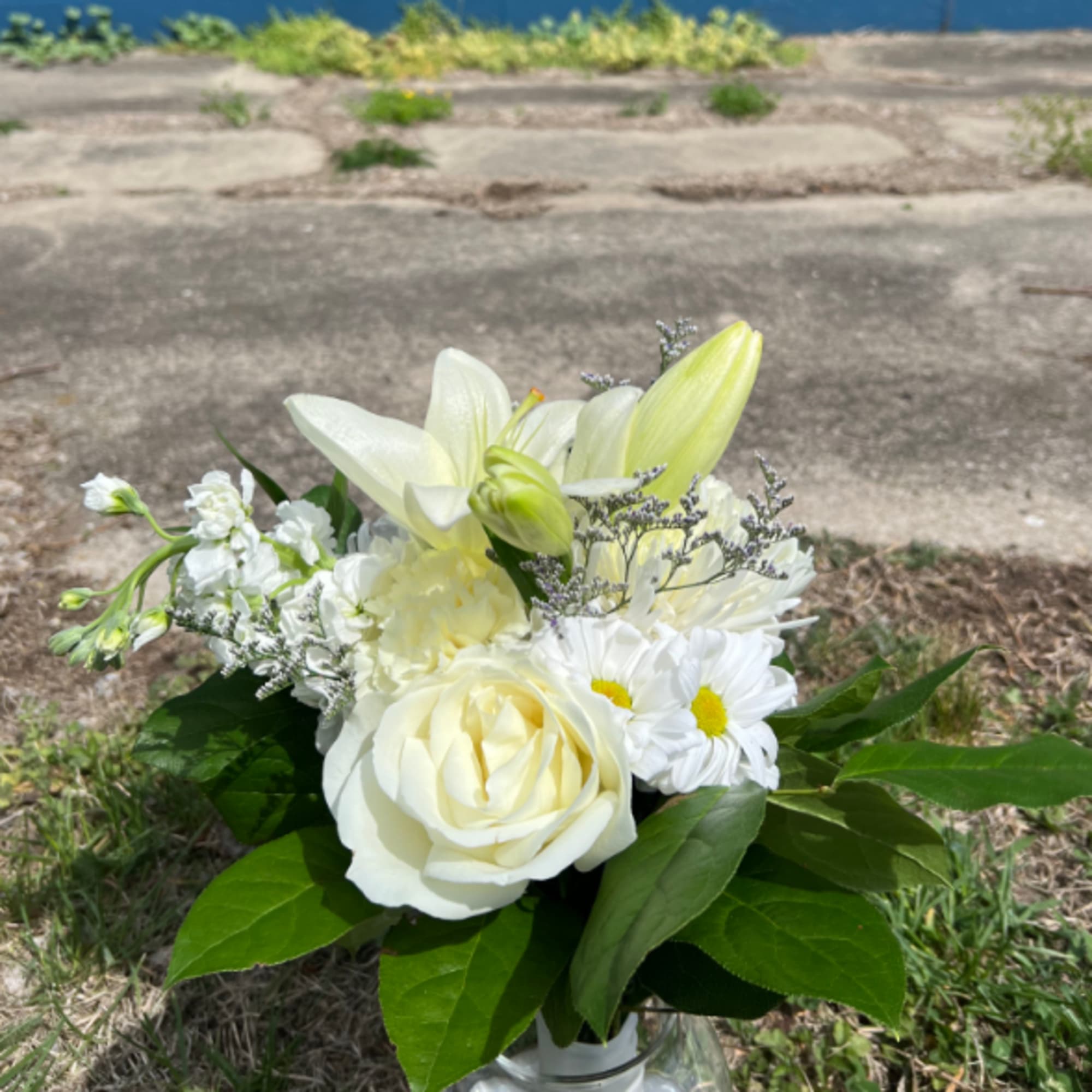 An elegant hand-tied bouquet that will compliment any prom outfit. Filled with