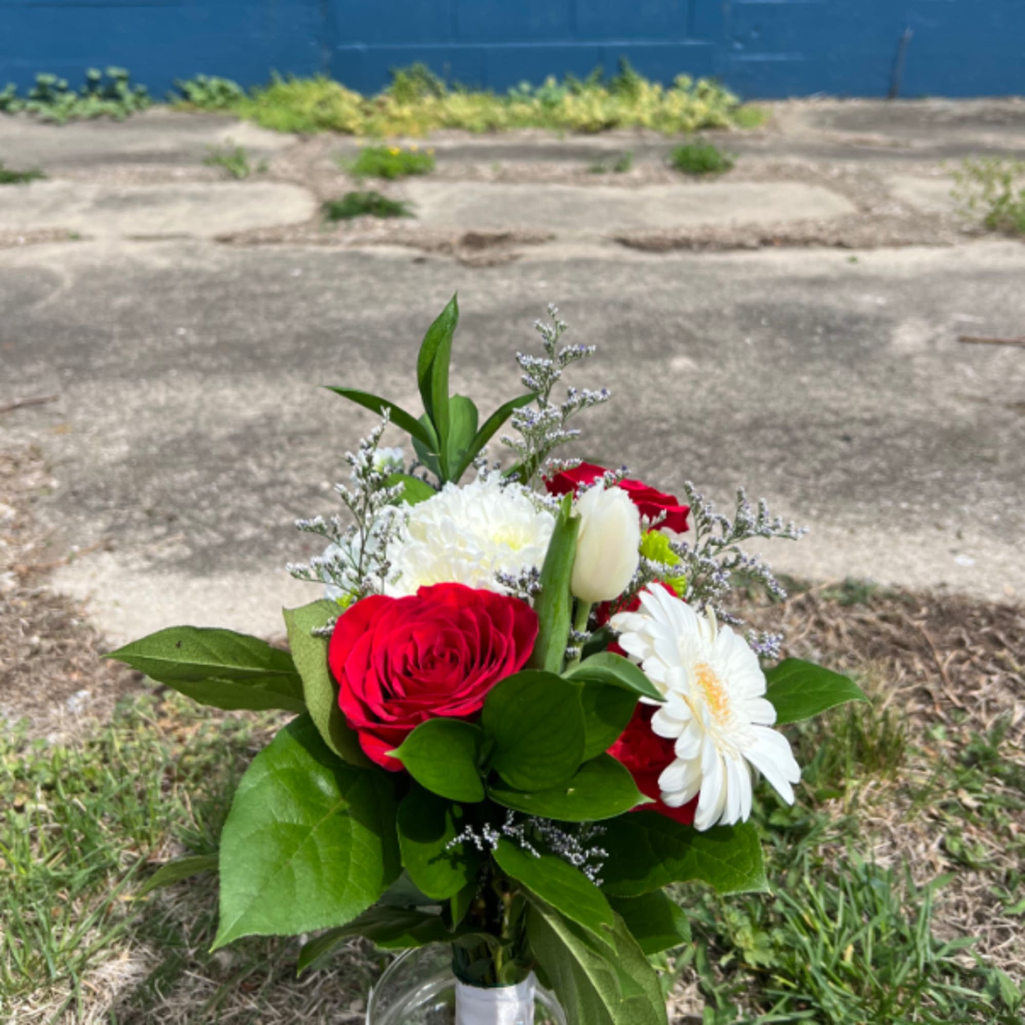 An elegant hand-tied bouquet that will compliment any prom outfit. Filled with