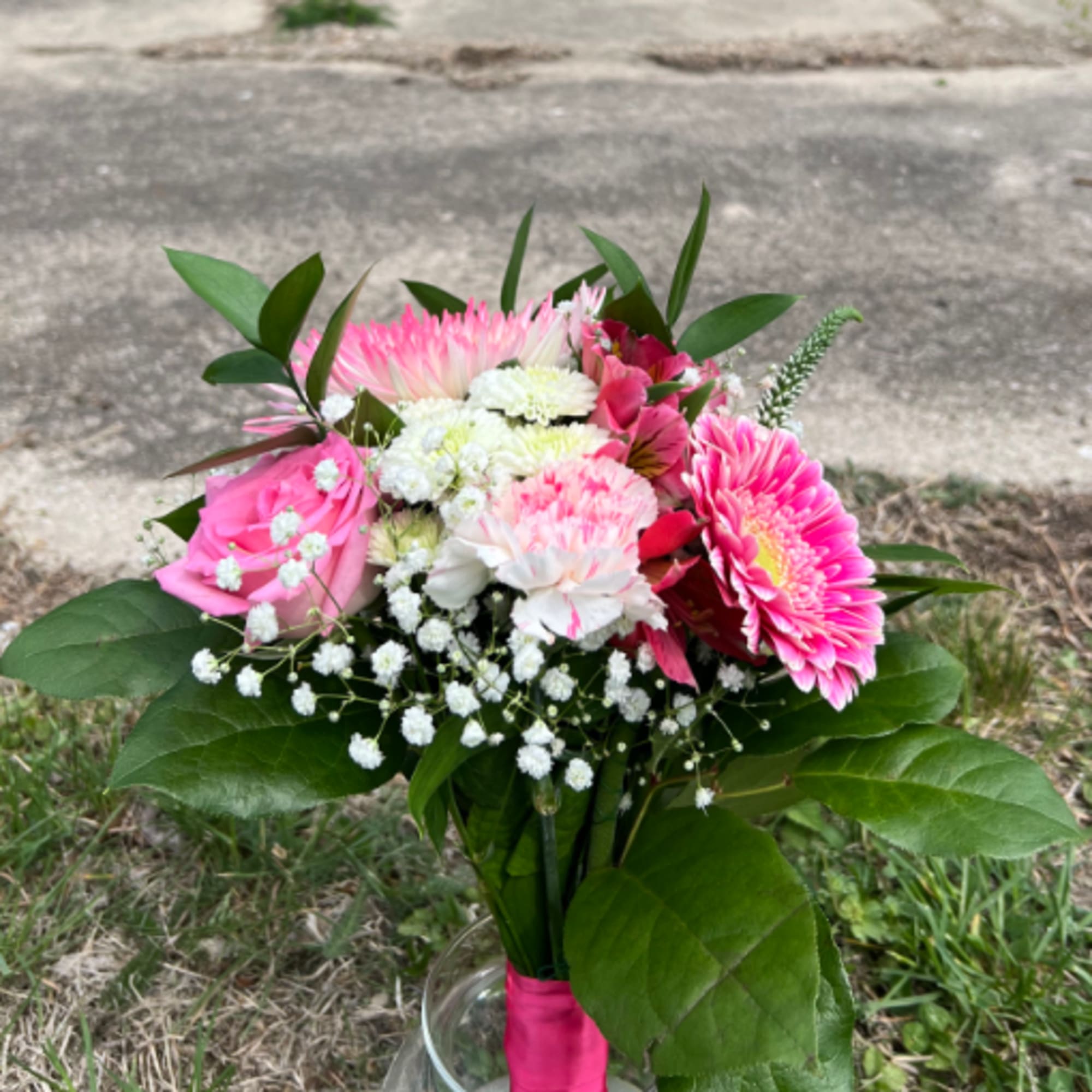 An elegant hand-tied bouquet that will compliment any prom outfit. Filled with