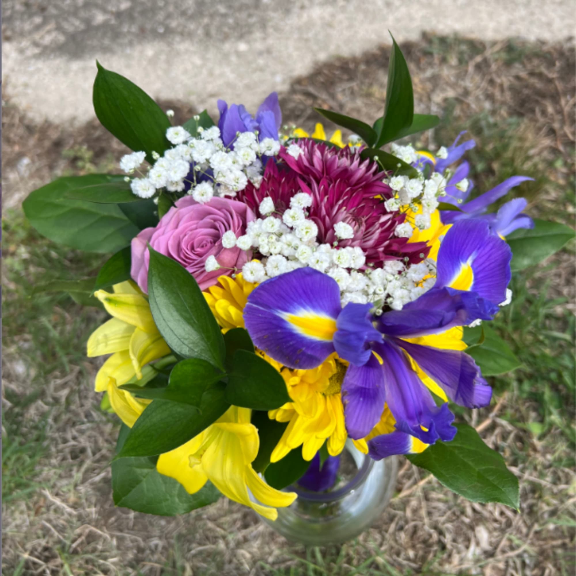 An elegant and colorful hand-tied bouquet that will compliment any prom outfit.