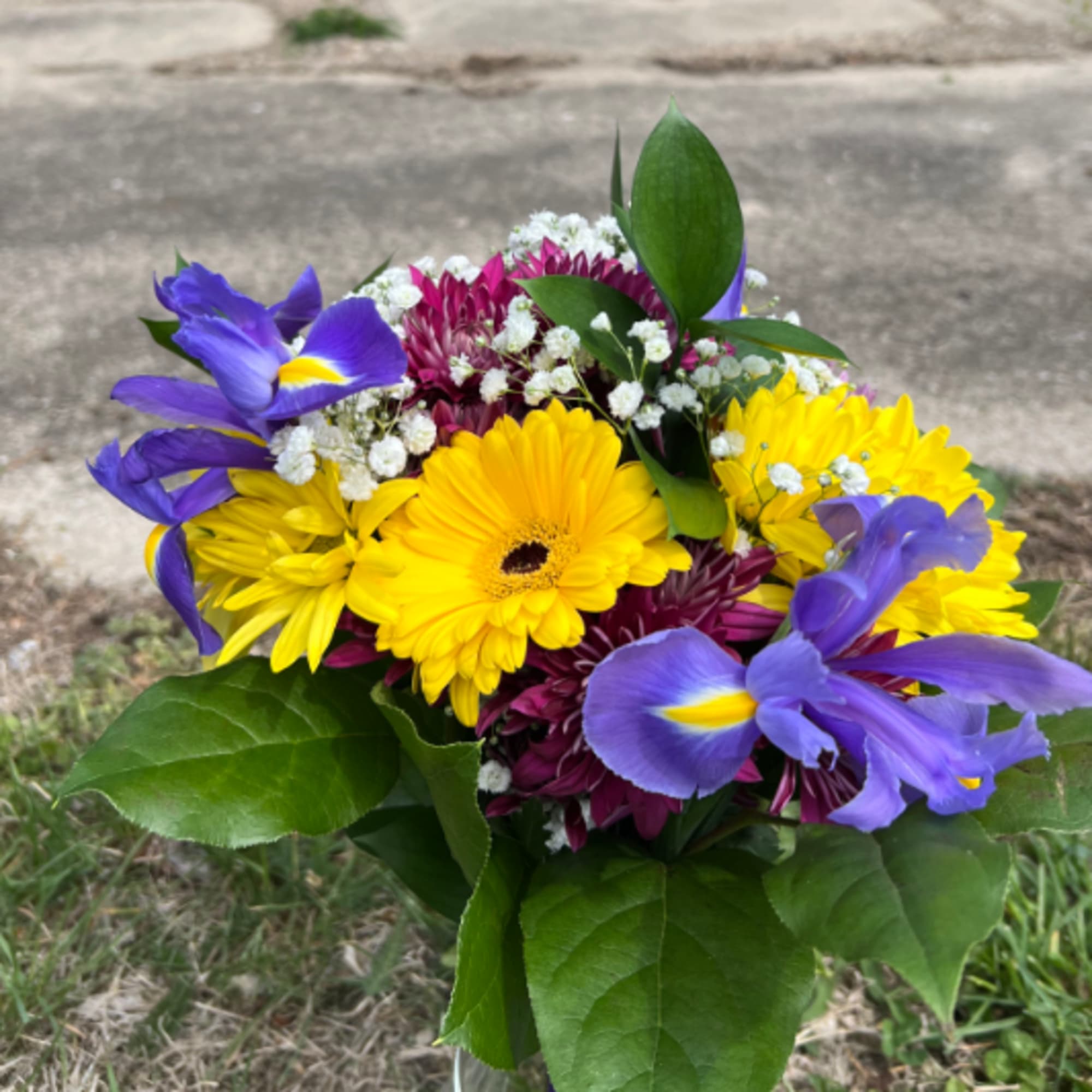 An elegant and colorful hand-tied bouquet that will compliment any prom outfit.