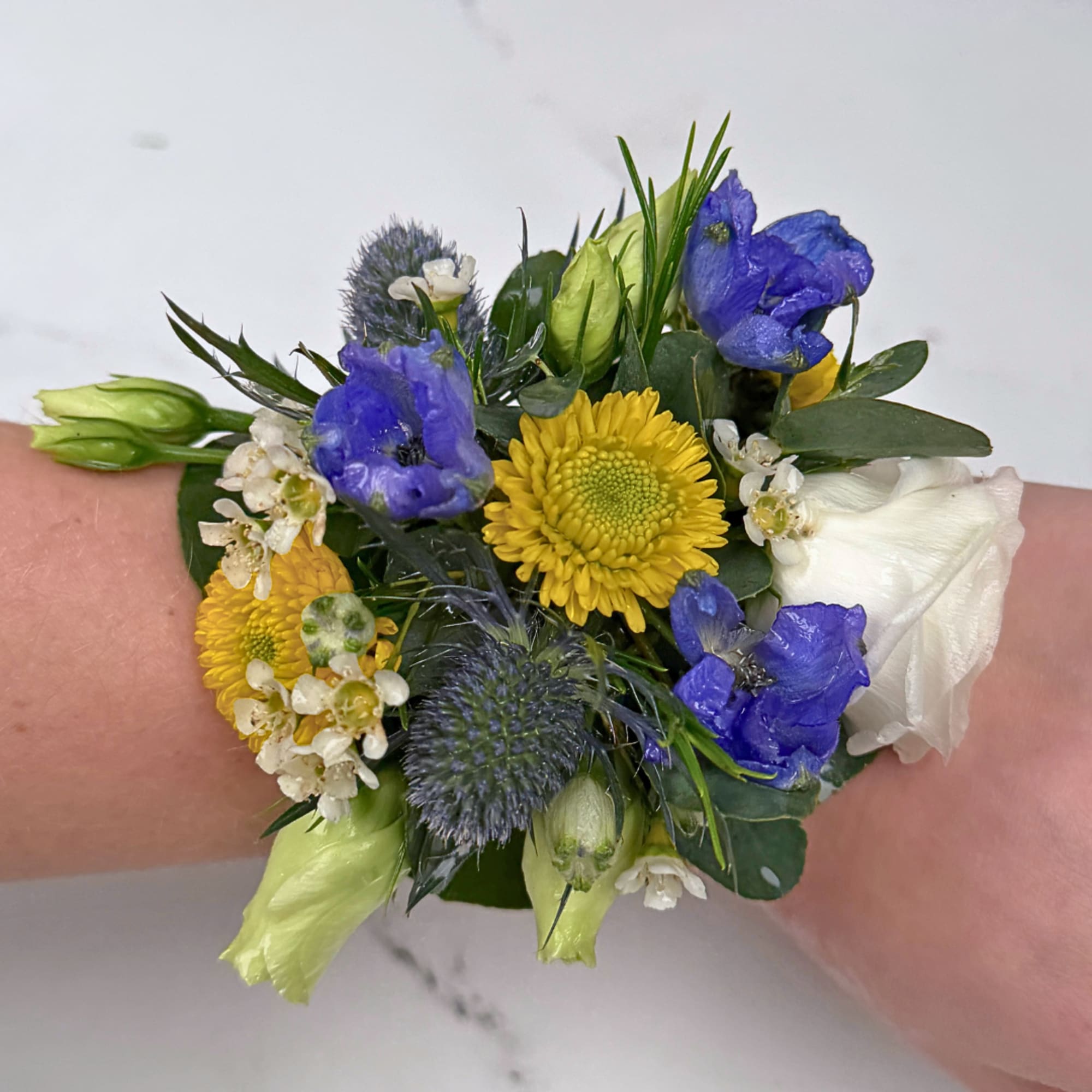 A bright, compact wrist corsage that turns any prom, wedding, or special-occasion