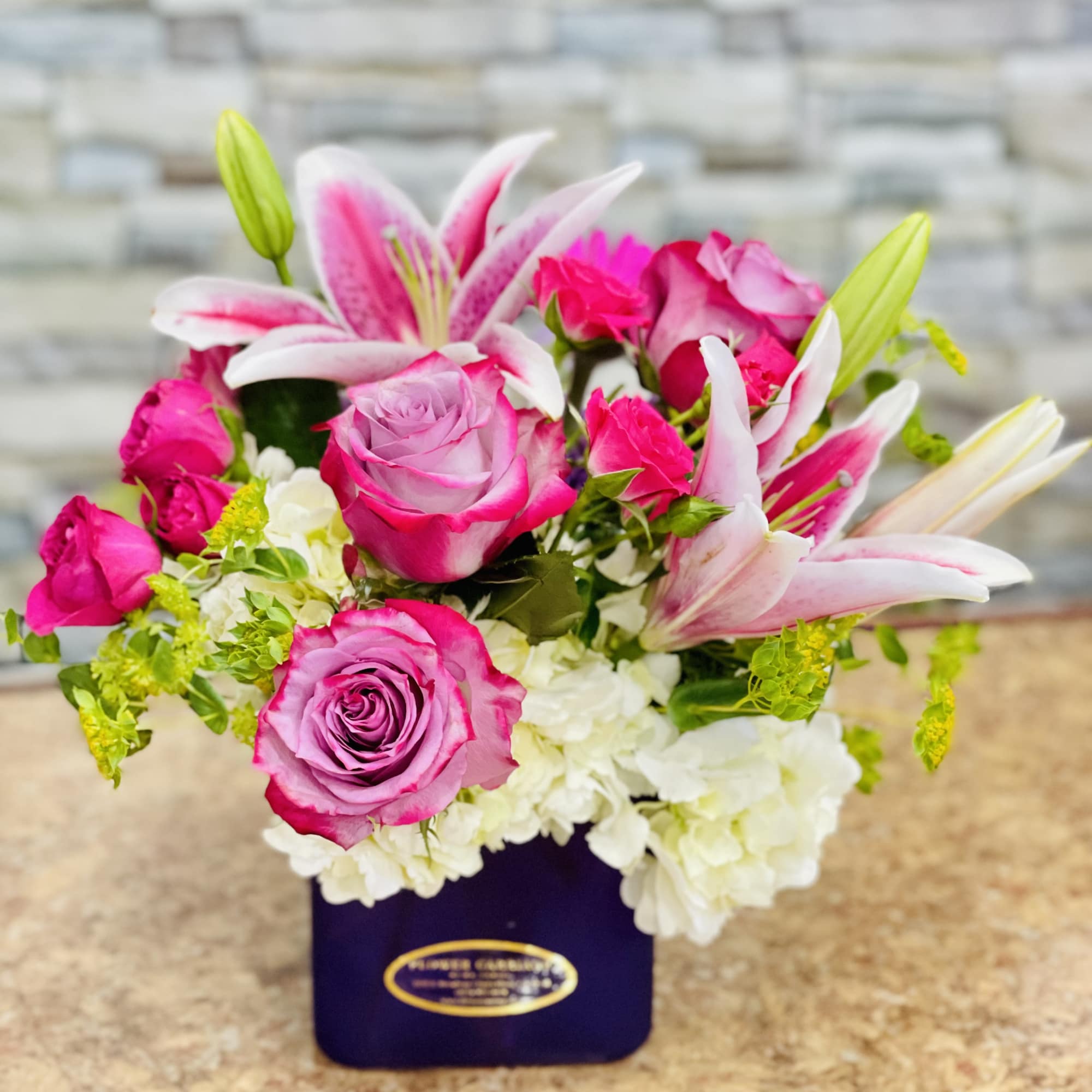Share what's in your heart with this warm and sunny vase arrangement;