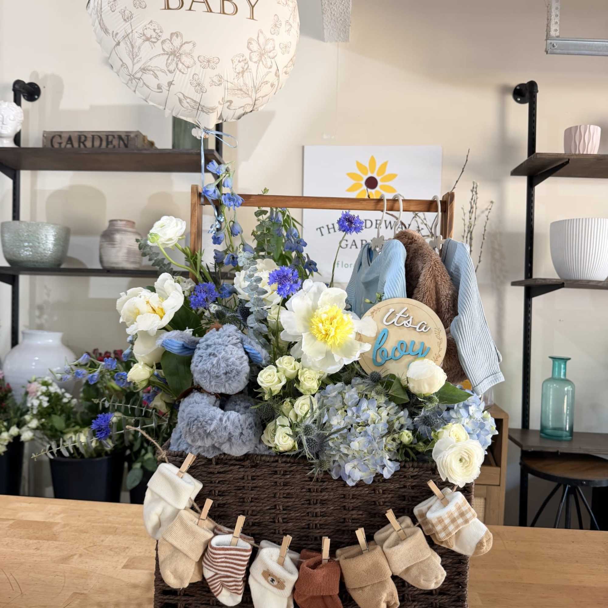 Classic offers a soft floral welcome with keepsake essentials. Luxe includes a