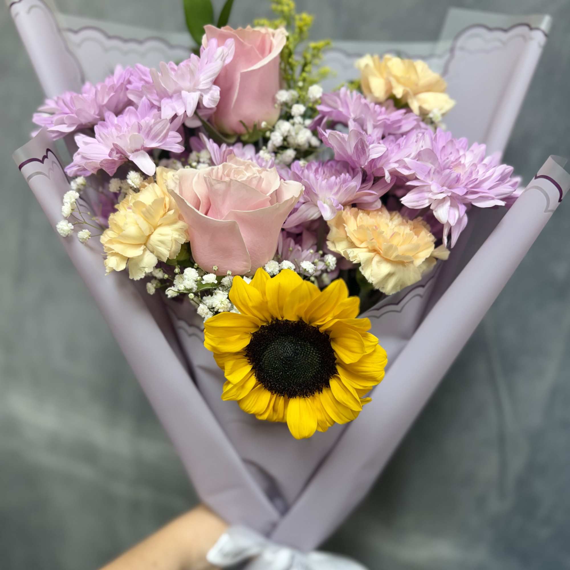 A delightful fusion of sunny vibrancy and lavender tones with pink toned