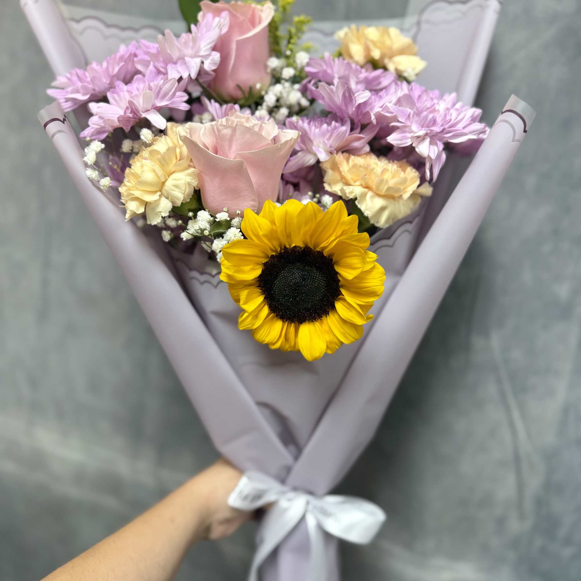 A delightful fusion of sunny vibrancy and lavender tones with pink toned