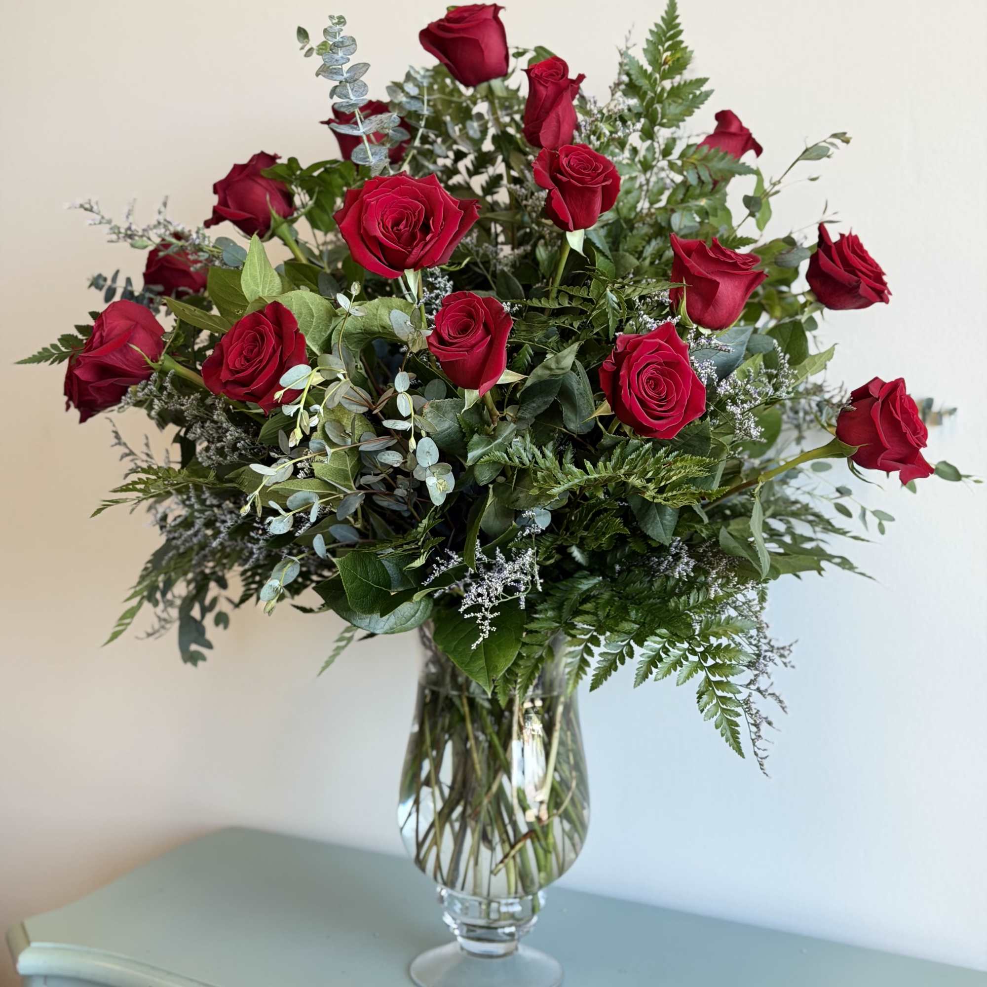 Bouquet of red roses in a clear glass vase