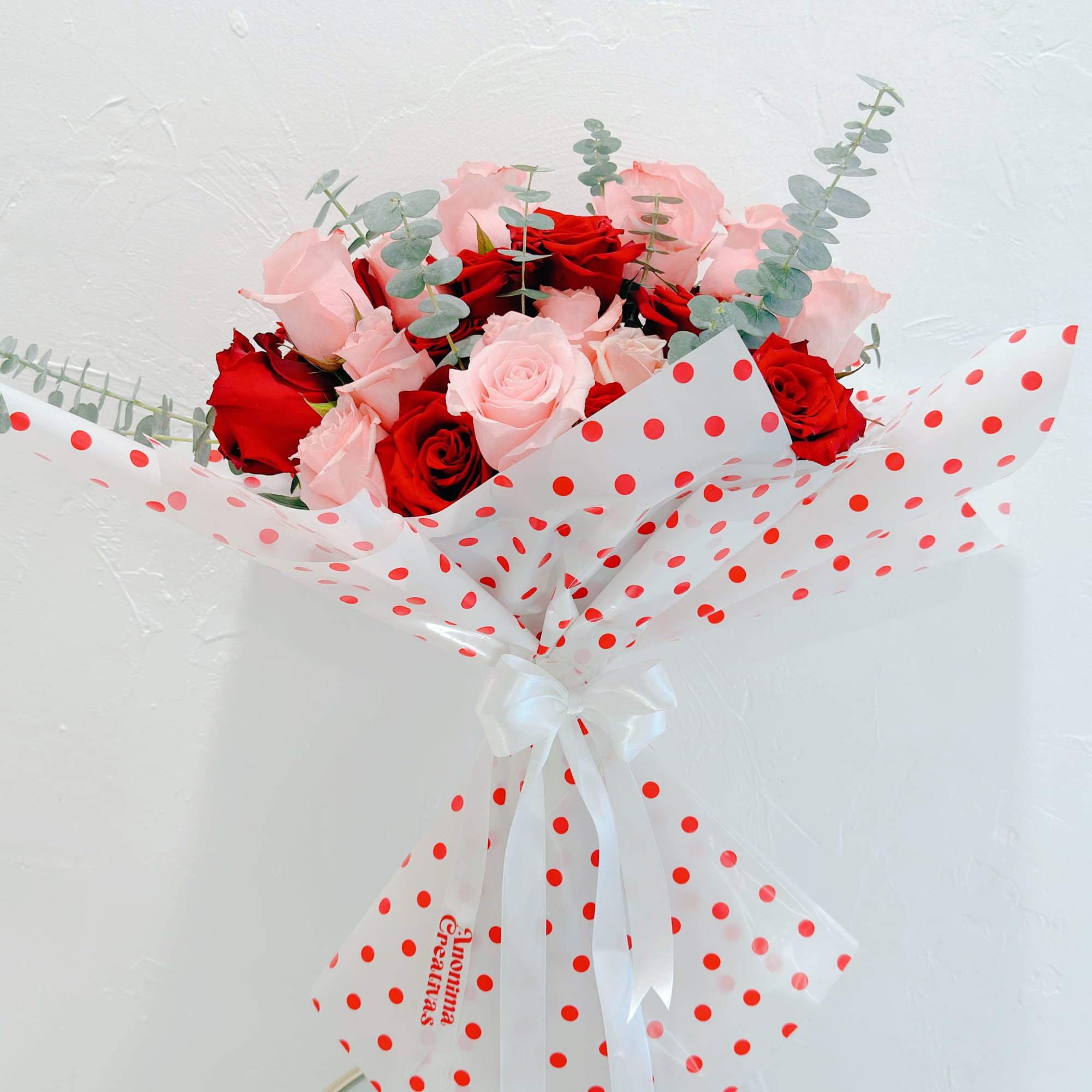 Elegant and delicate bouquet featuring a beautiful mix of red and pink
