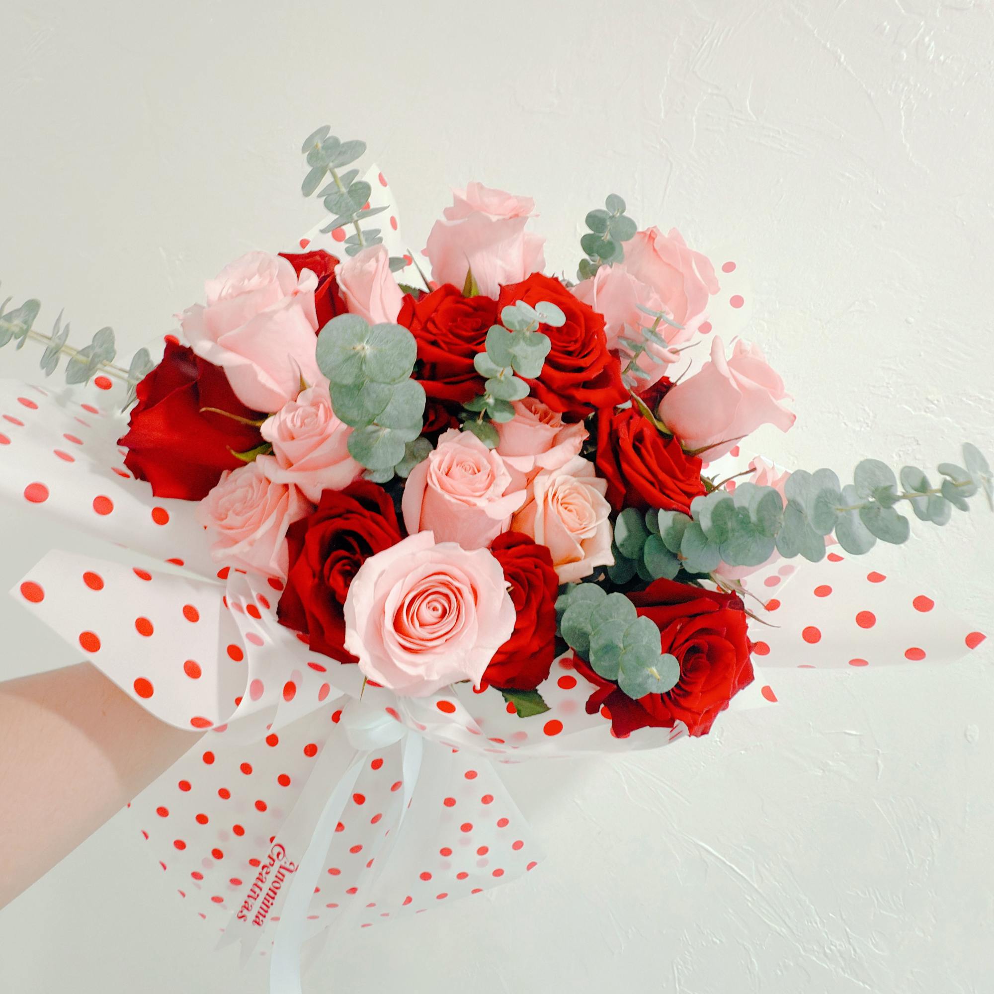 Elegant and delicate bouquet featuring a beautiful mix of red and pink