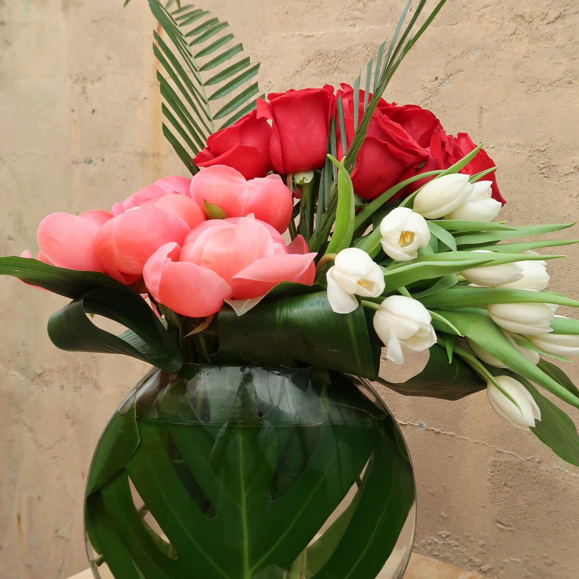 Devotion is filled with peonies, tulips, and roses elegantly arranged.