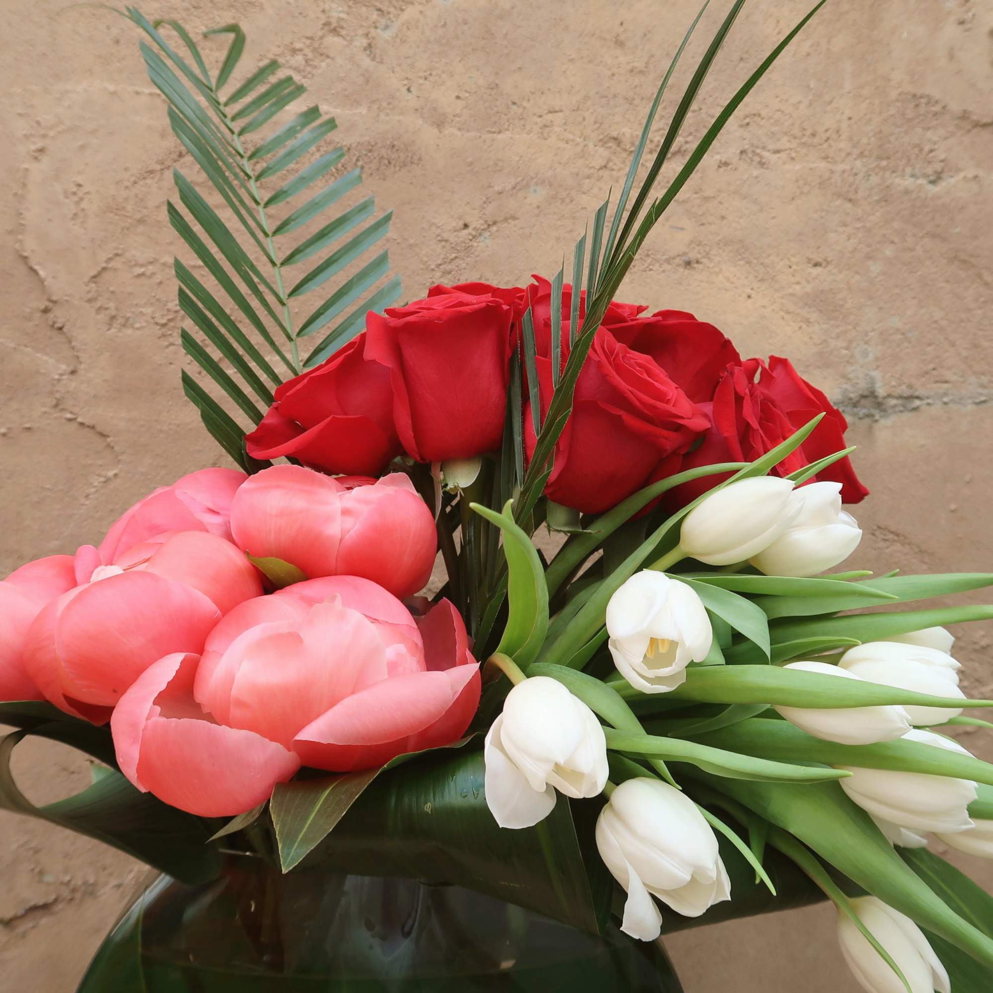 Devotion is filled with peonies, tulips, and roses elegantly arranged.
