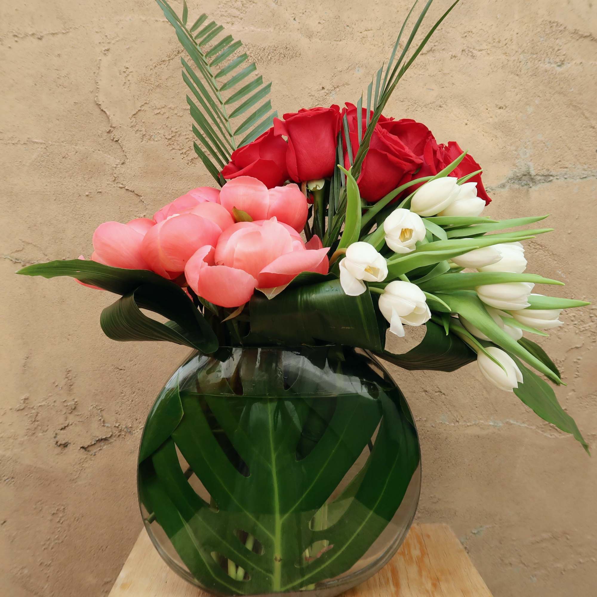 Devotion is filled with peonies, tulips, and roses elegantly arranged.