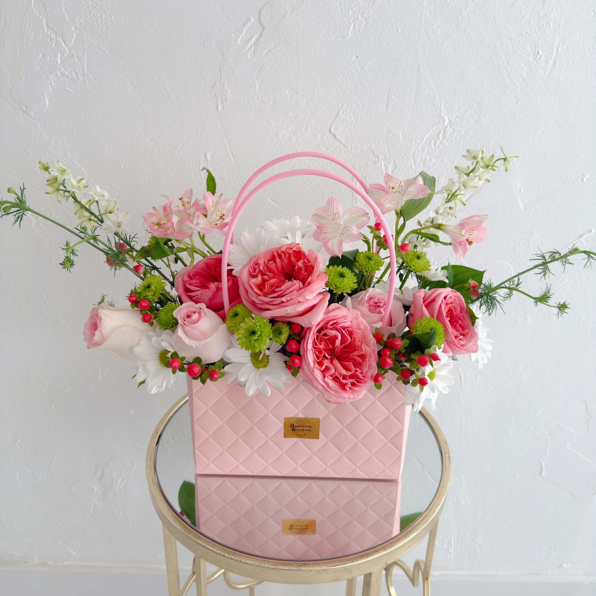 Elevate any moment with this sophisticated and charming arrangement. Designed in an