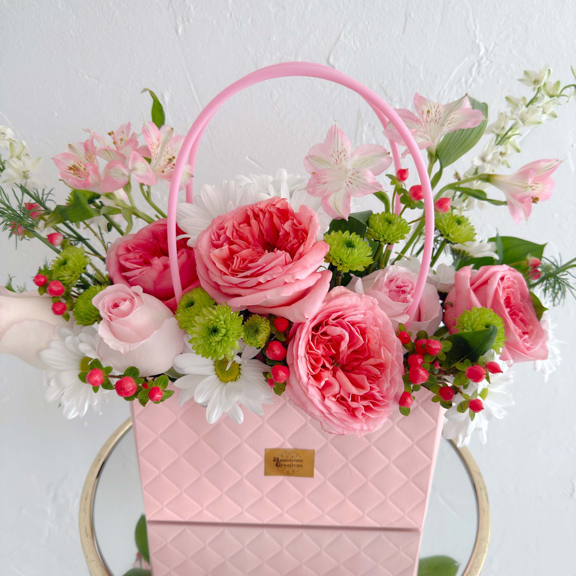 Elevate any moment with this sophisticated and charming arrangement. Designed in an