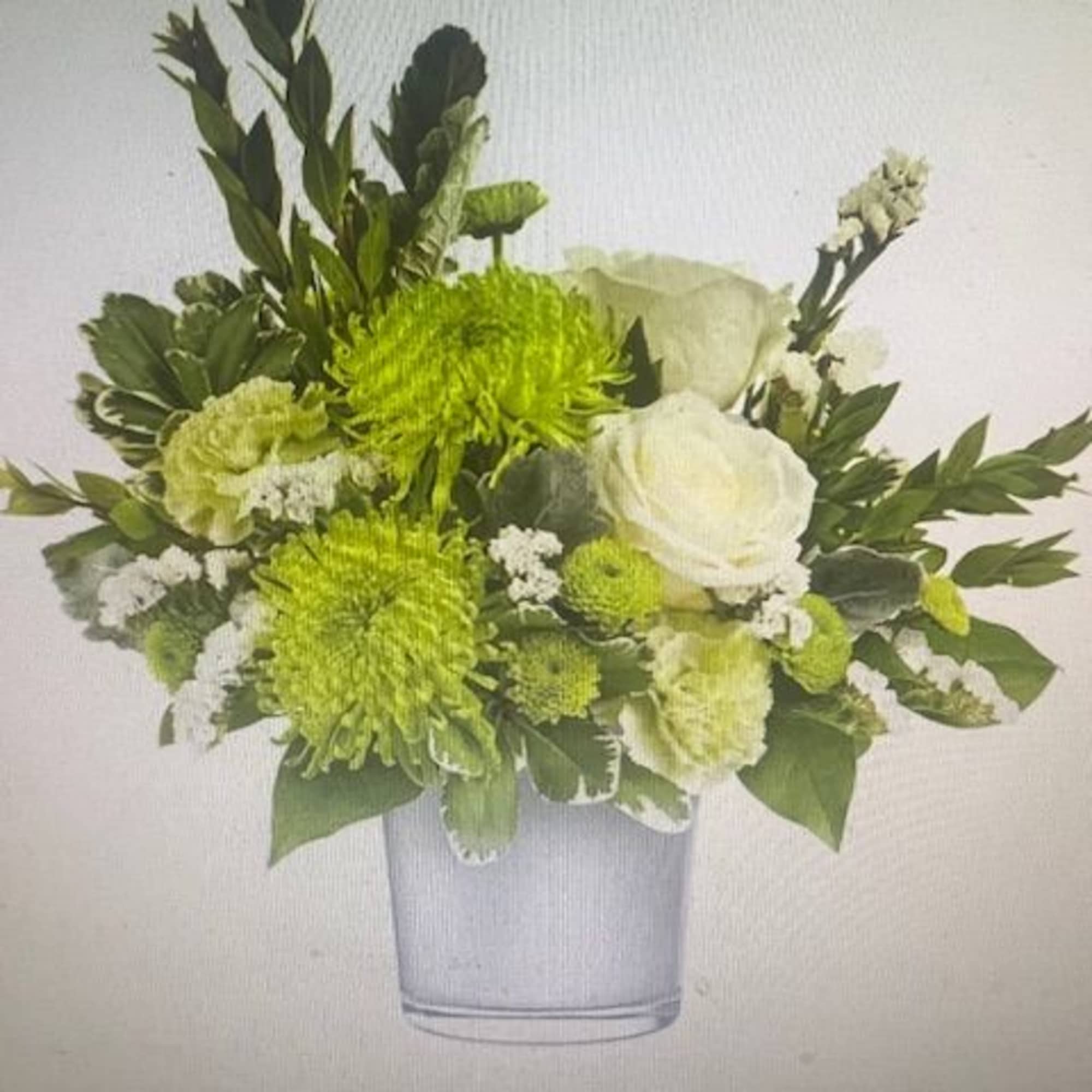 Lime-green chrysanthemums paired with crisp white roses and pale green carnations make