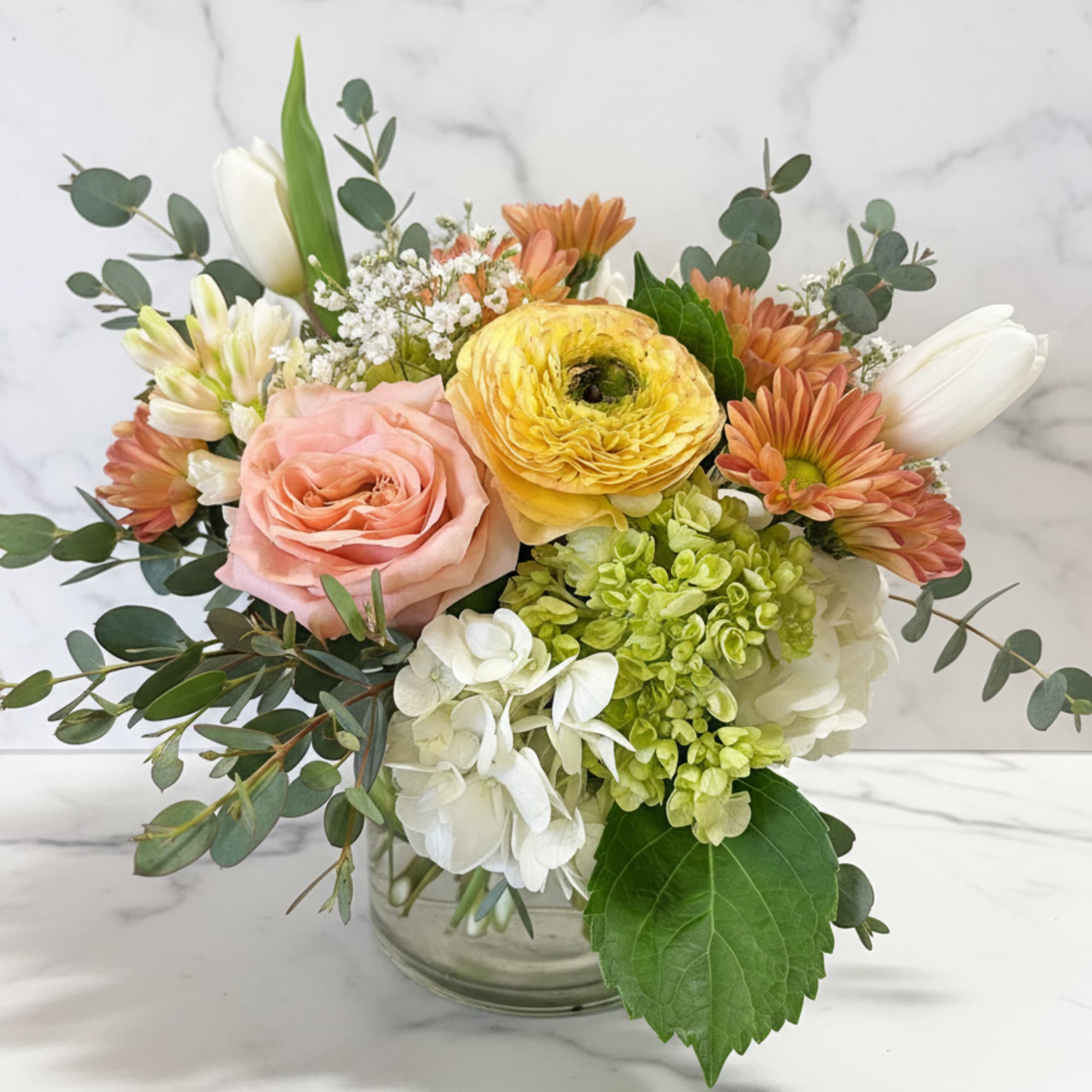 Just picked from the garden pastel toned flowers in a cylinder or