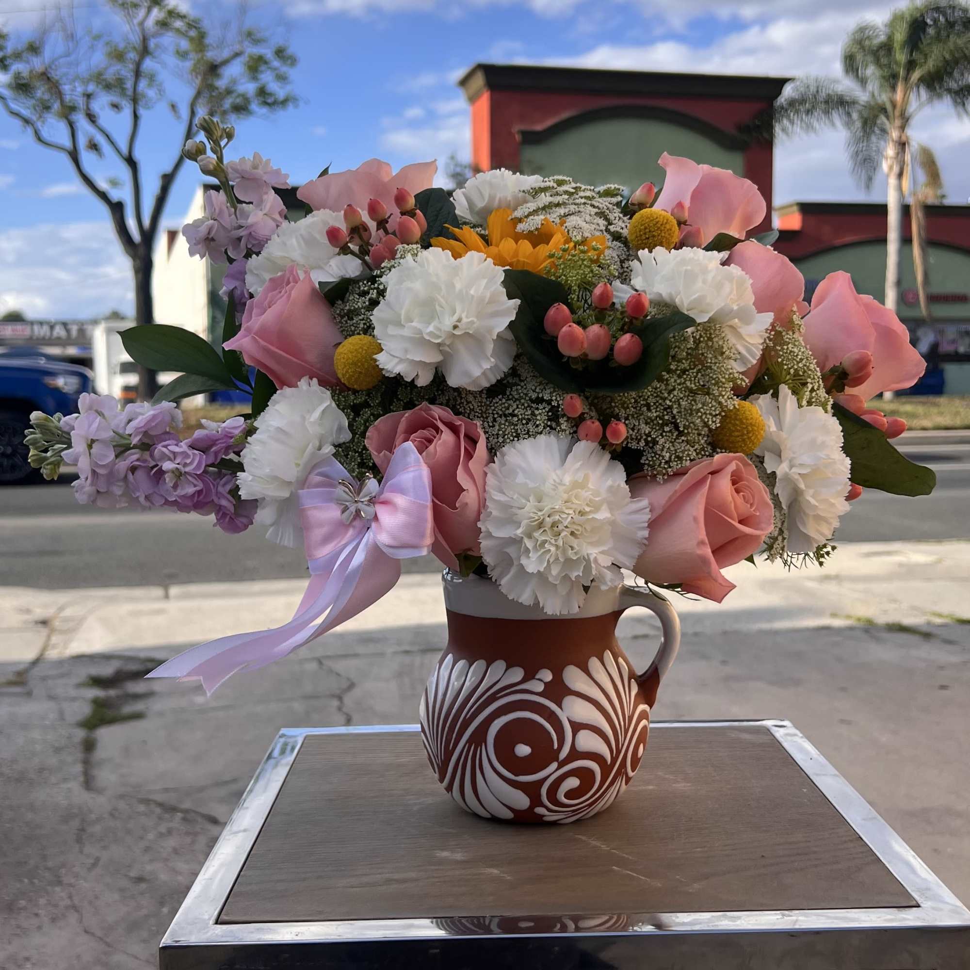 A soft and elegant mix of blush roses and delicate blooms, beautifully