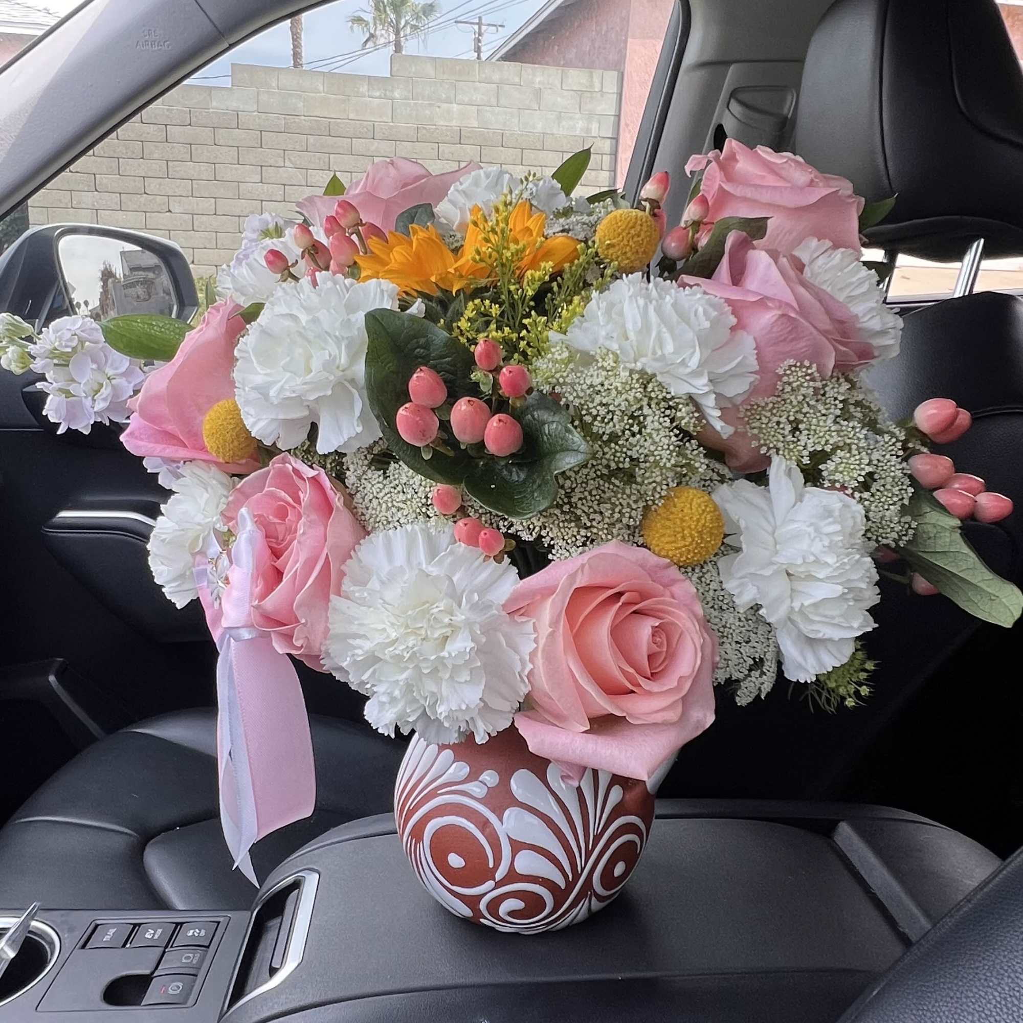 A soft and elegant mix of blush roses and delicate blooms, beautifully