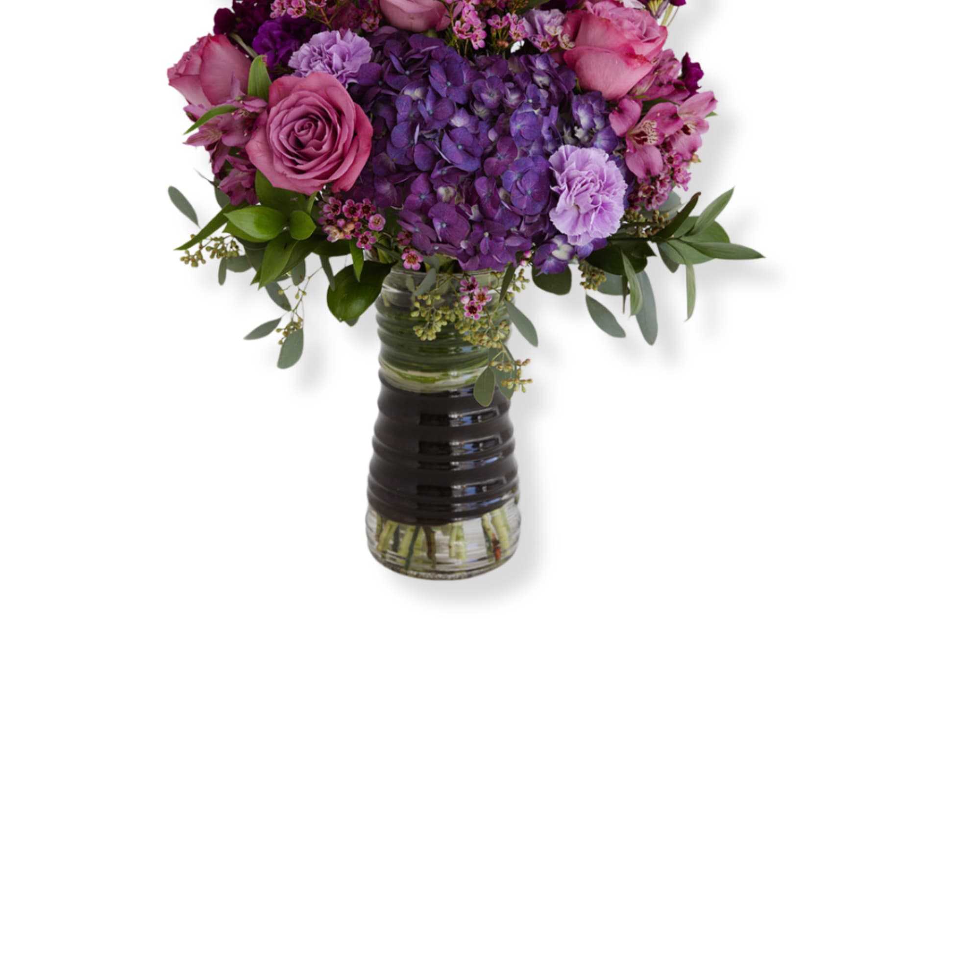 Pink and purple bouquet in a glass vase