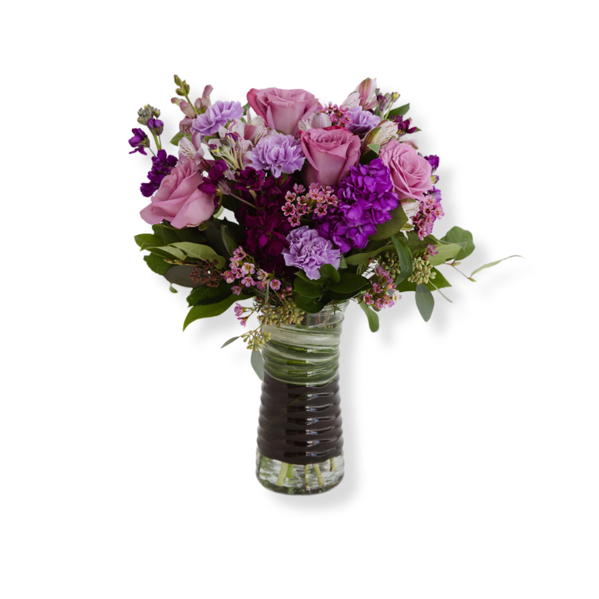 Vases of purple roses and seasonal flowers 