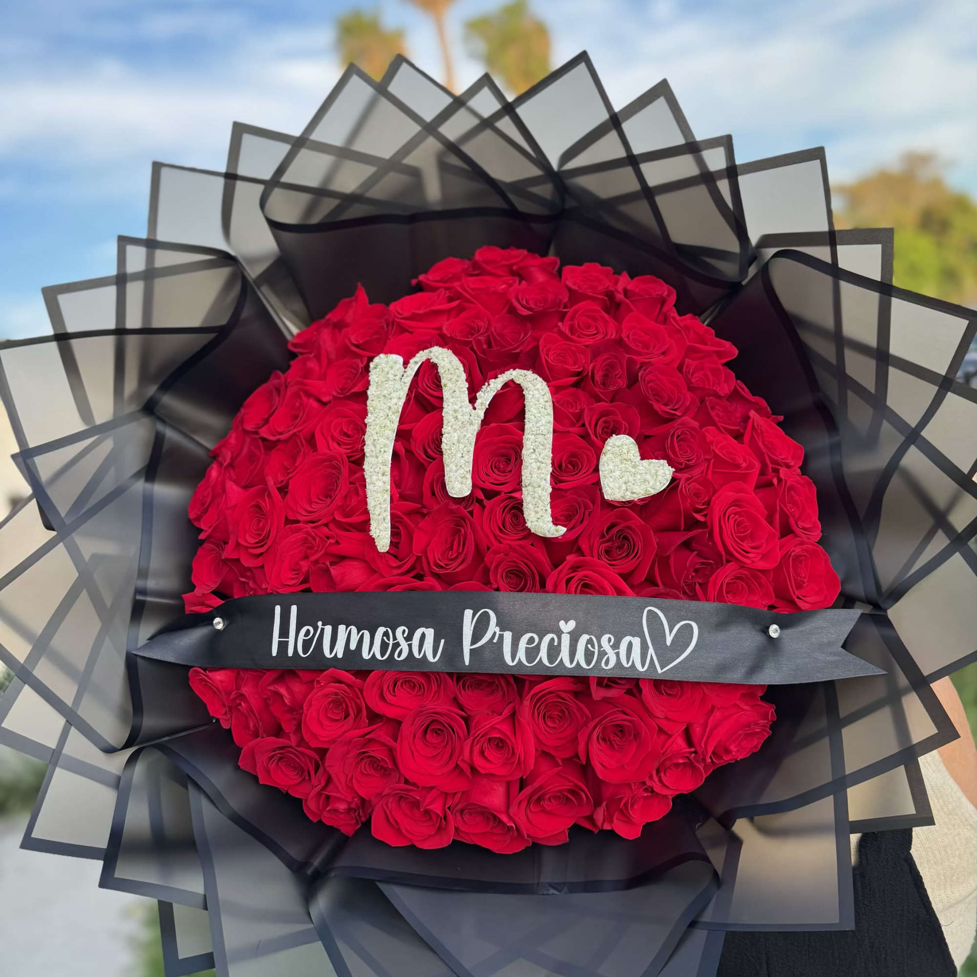 Red roses with your choice of baby&rsquo;s breath letter and personalized ribbon.