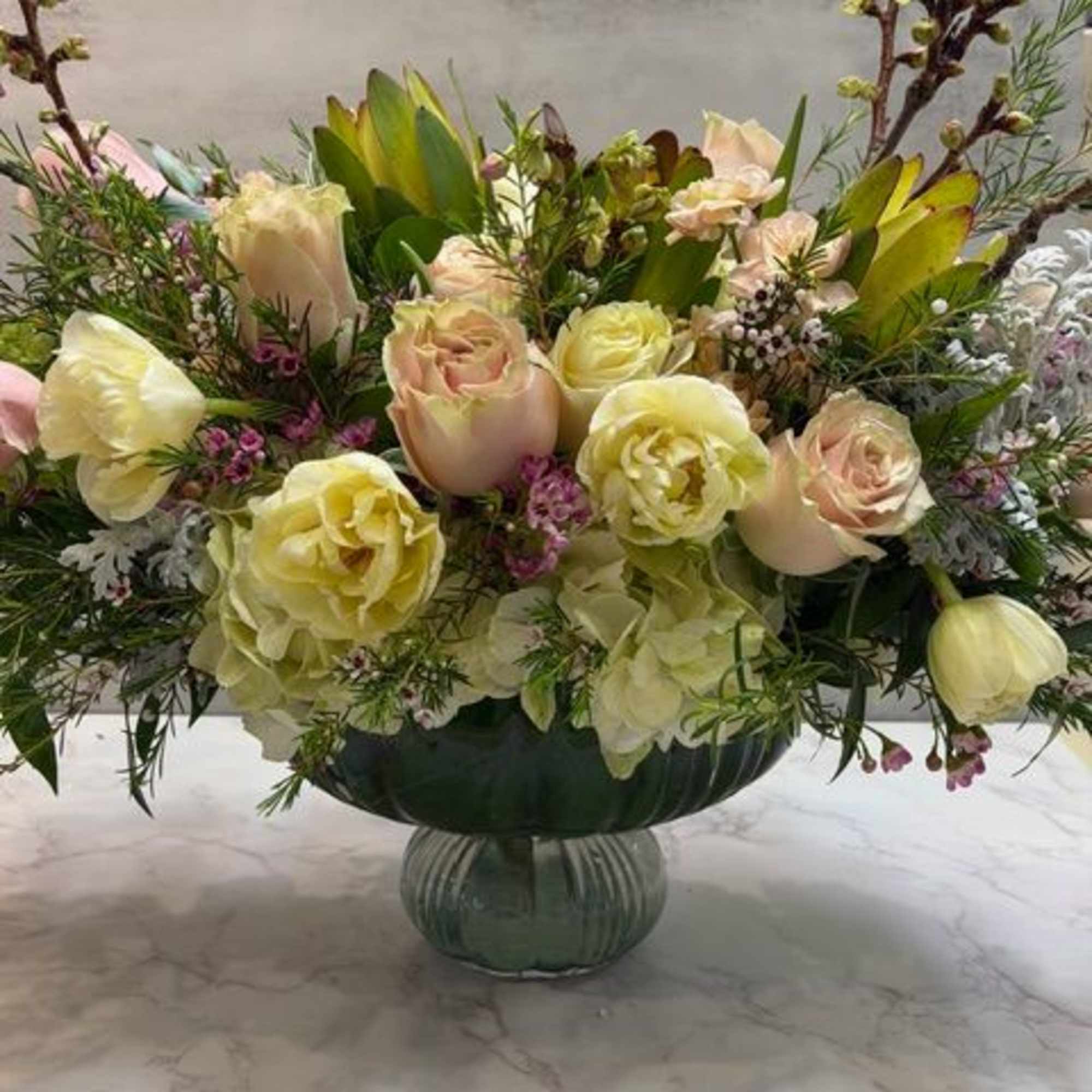 A beautiful keepsake vase measuring 6" tall x 8" opening filled with