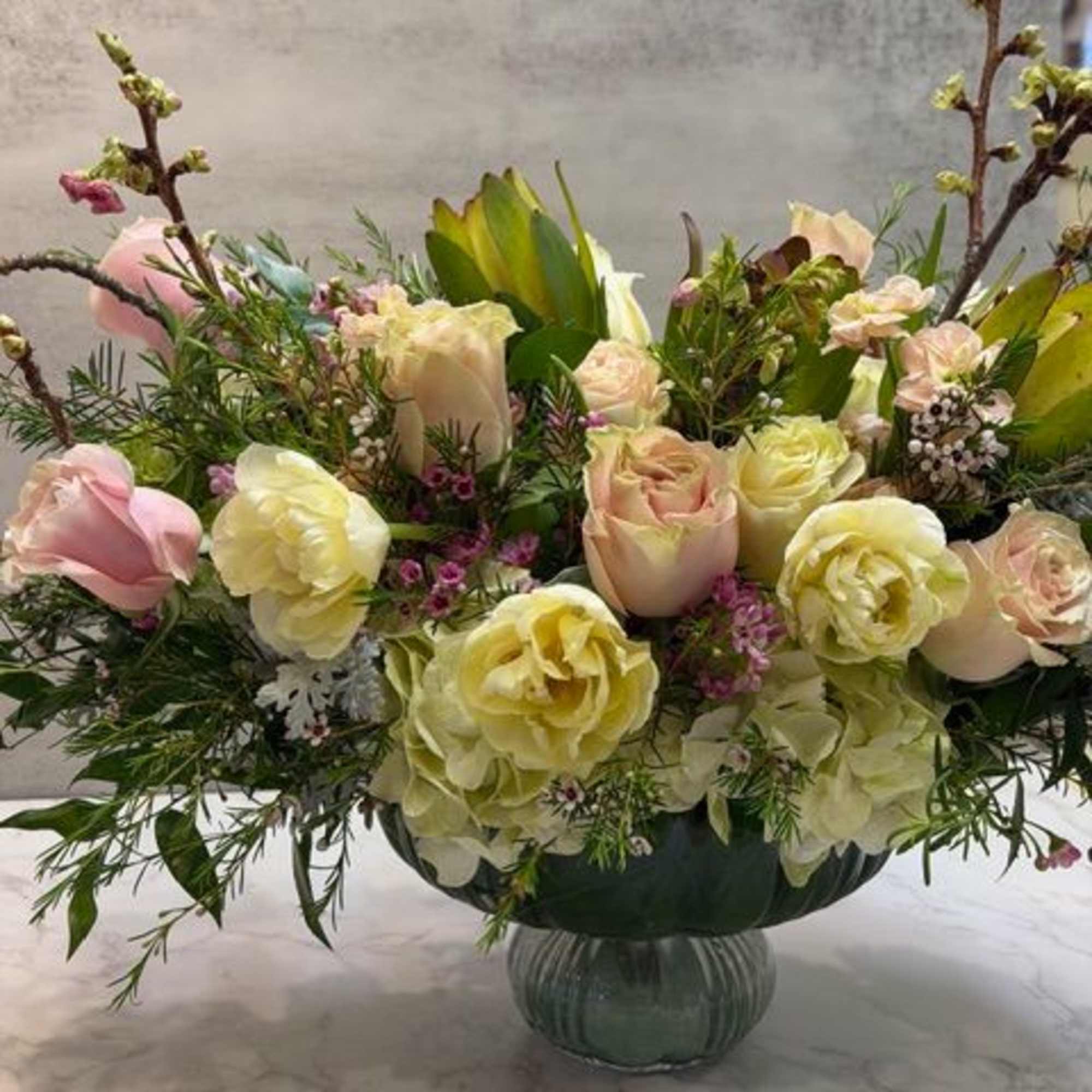 A beautiful keepsake vase measuring 6" tall x 8" opening filled with