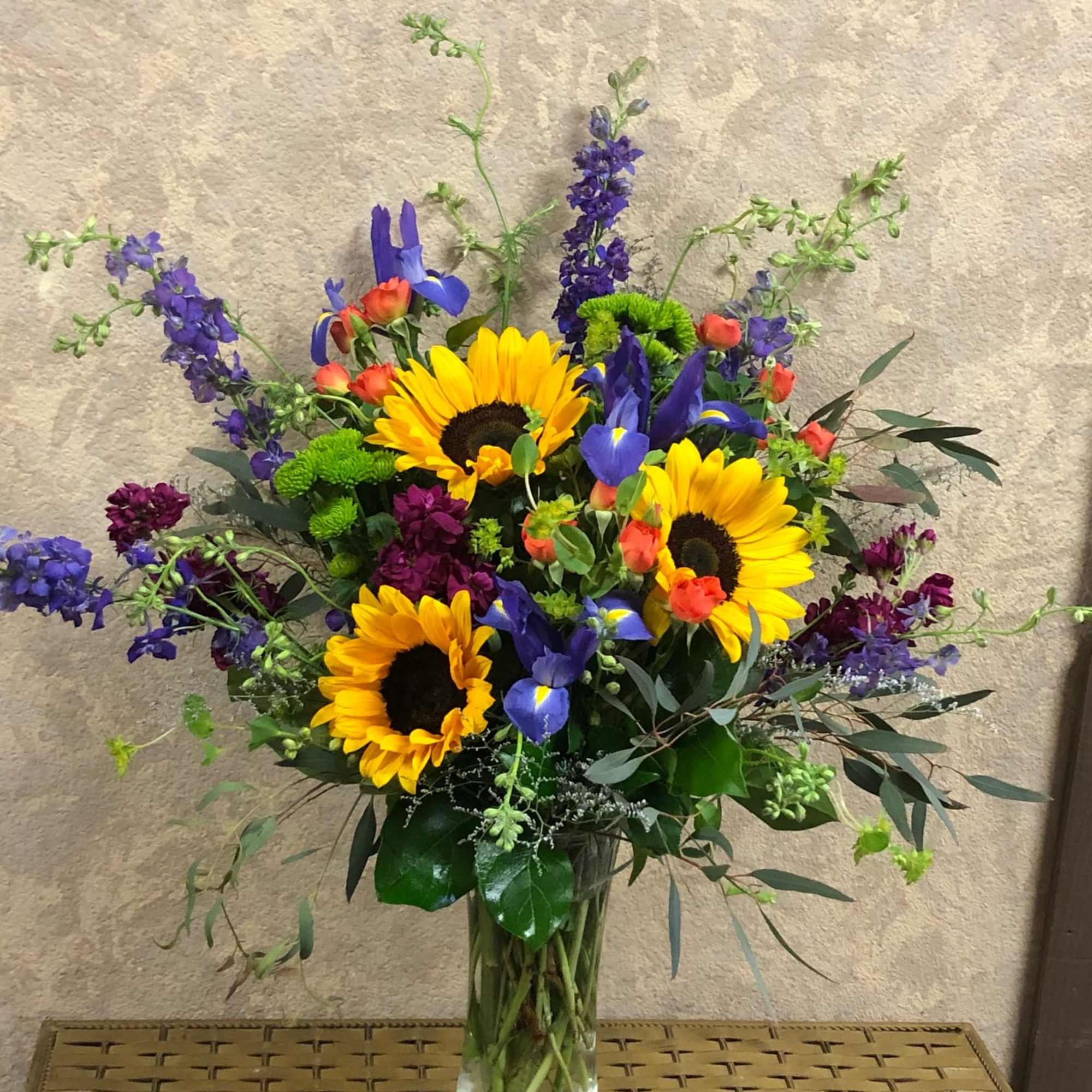 Recipe: Purple Larkspur, Sunflowers, Purple Iris, Orange Spray Roses, Burgundy Stock, Green