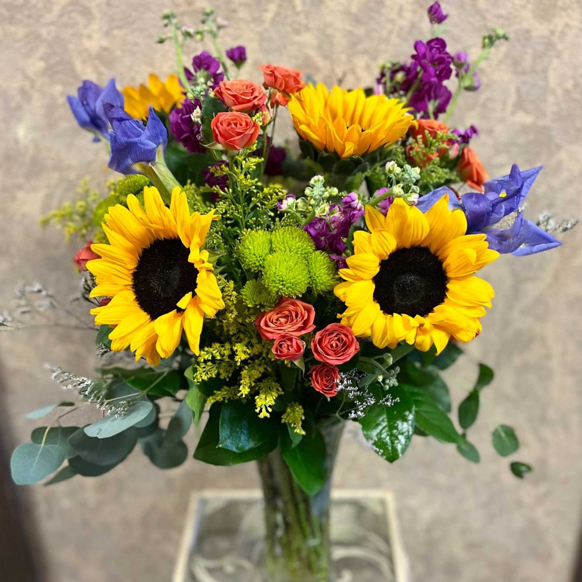 Recipe: Purple Larkspur, Sunflowers, Purple Iris, Orange Spray Roses, Burgundy Stock, Green