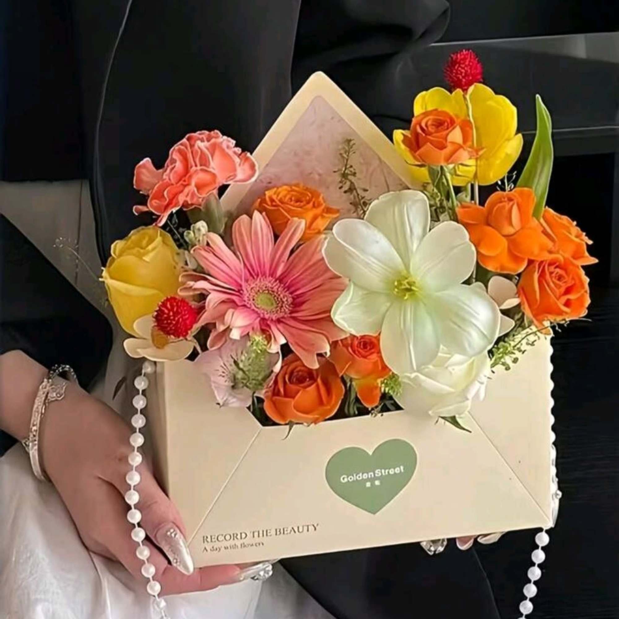 A mixed flowers make this envelope-style arrangement a delight for birthdays, anniversaries