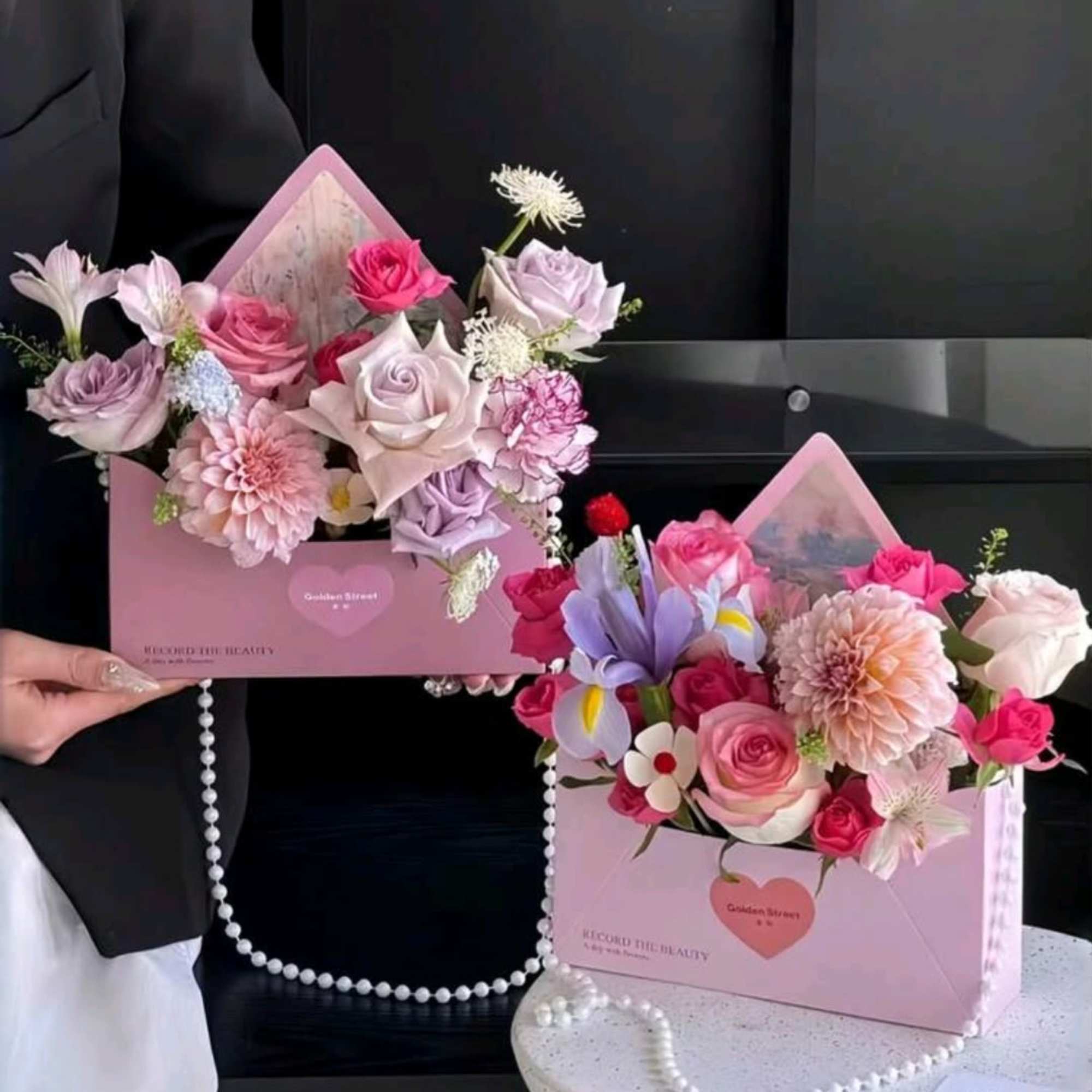 A mixed flowers make this envelope-style arrangement a delight for birthdays, anniversaries