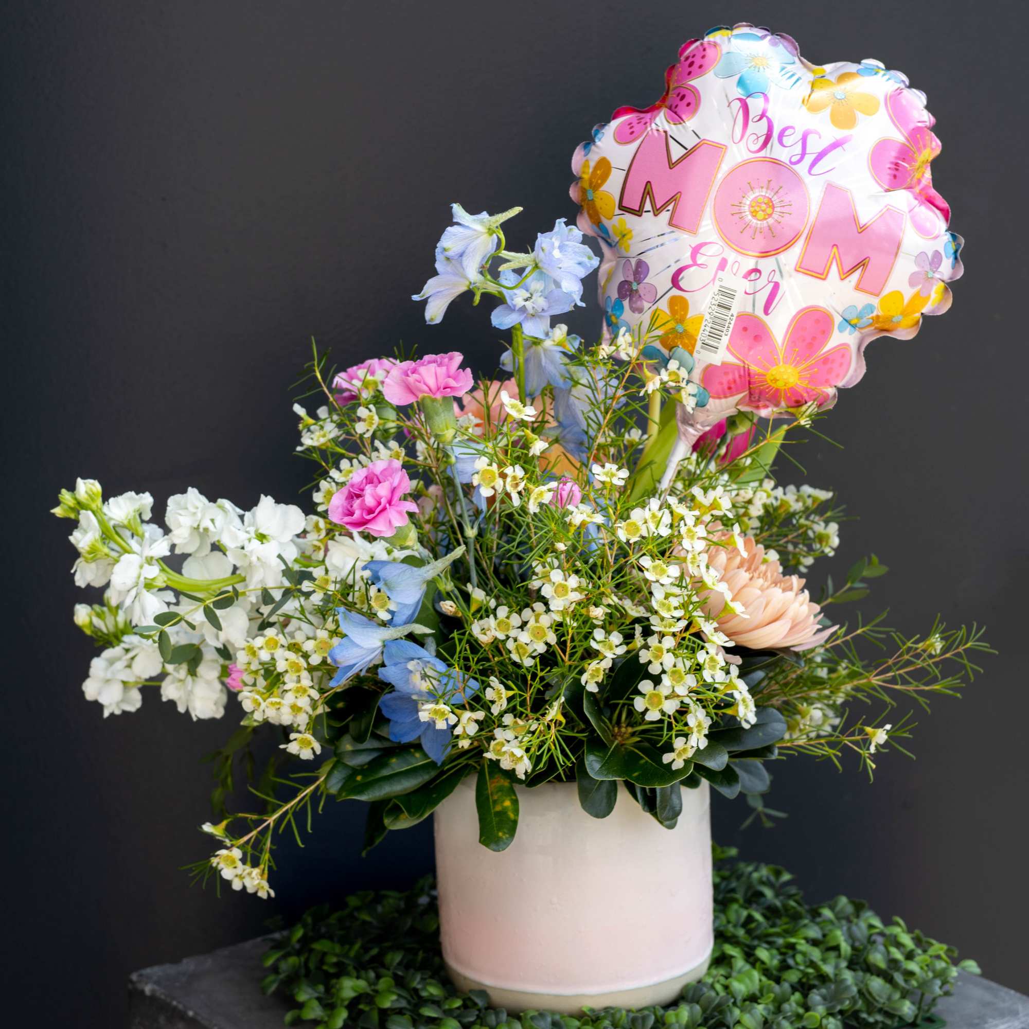 A fun bright floral arrangement full of color and life that is