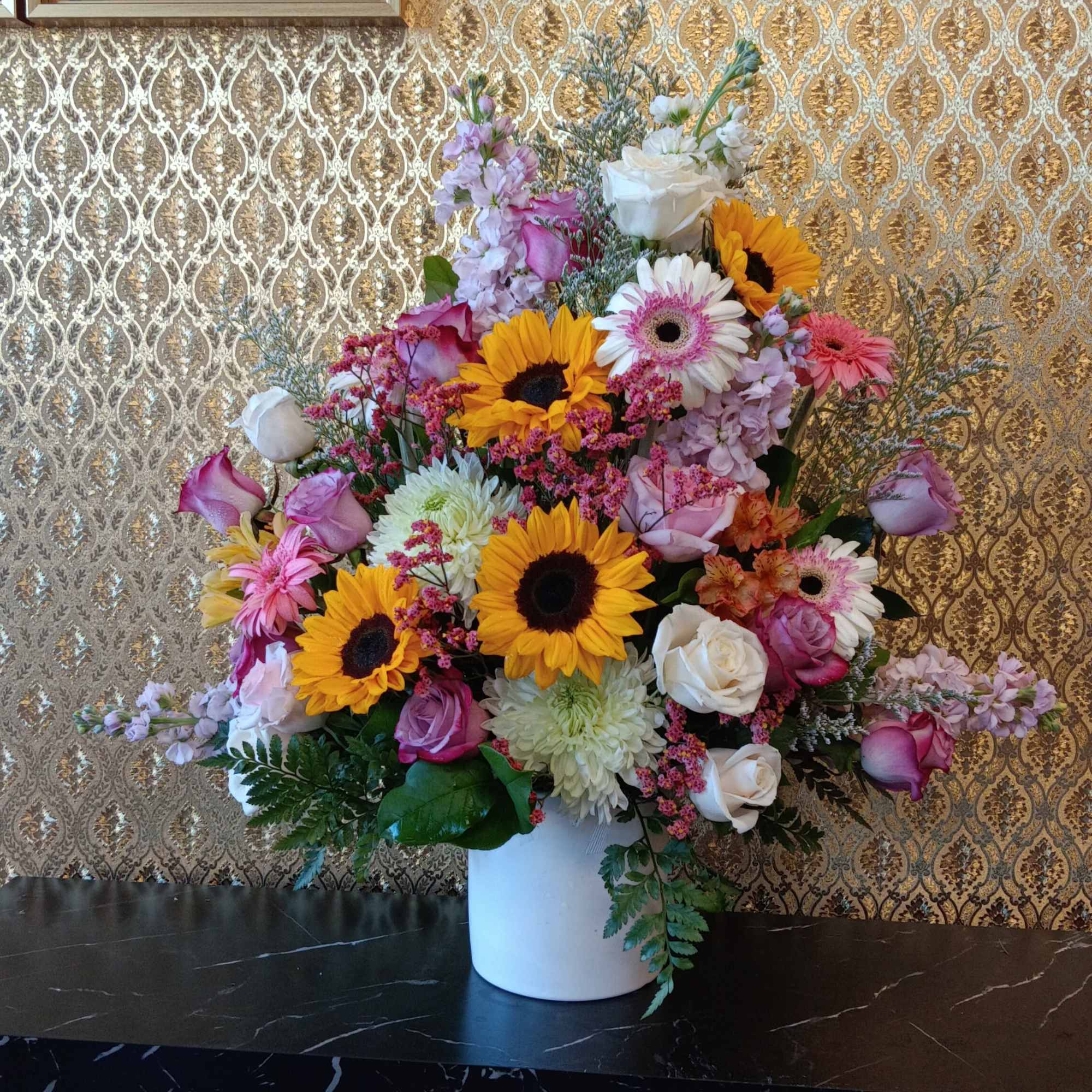 Exclusive from Ellie Flowers, includes fresh cut roses and mix yellow and