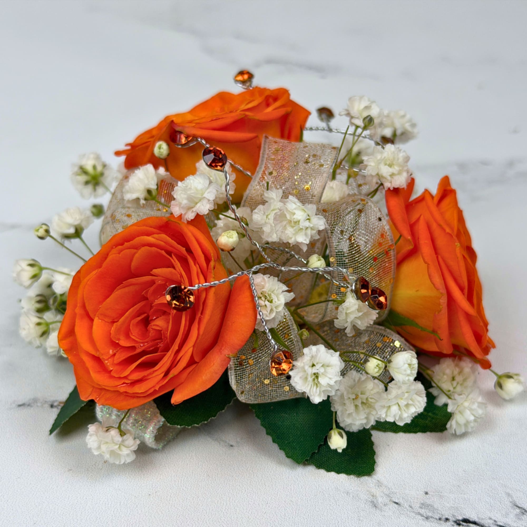 Three vivid orange roses take center stage in this version of our