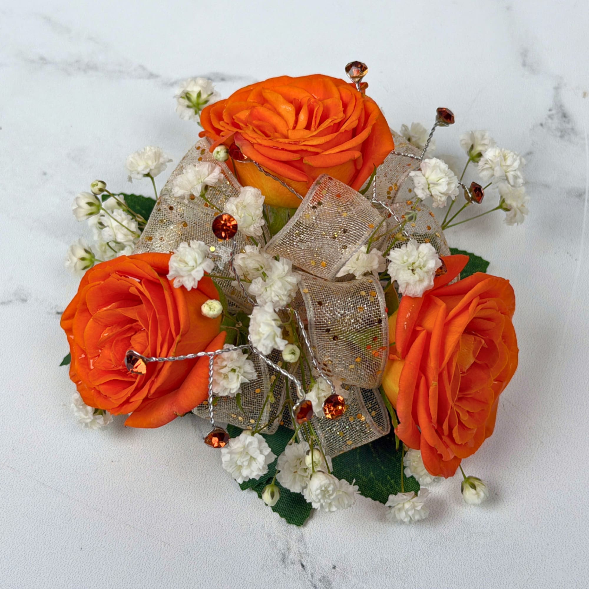 Three vivid orange roses take center stage in this version of our