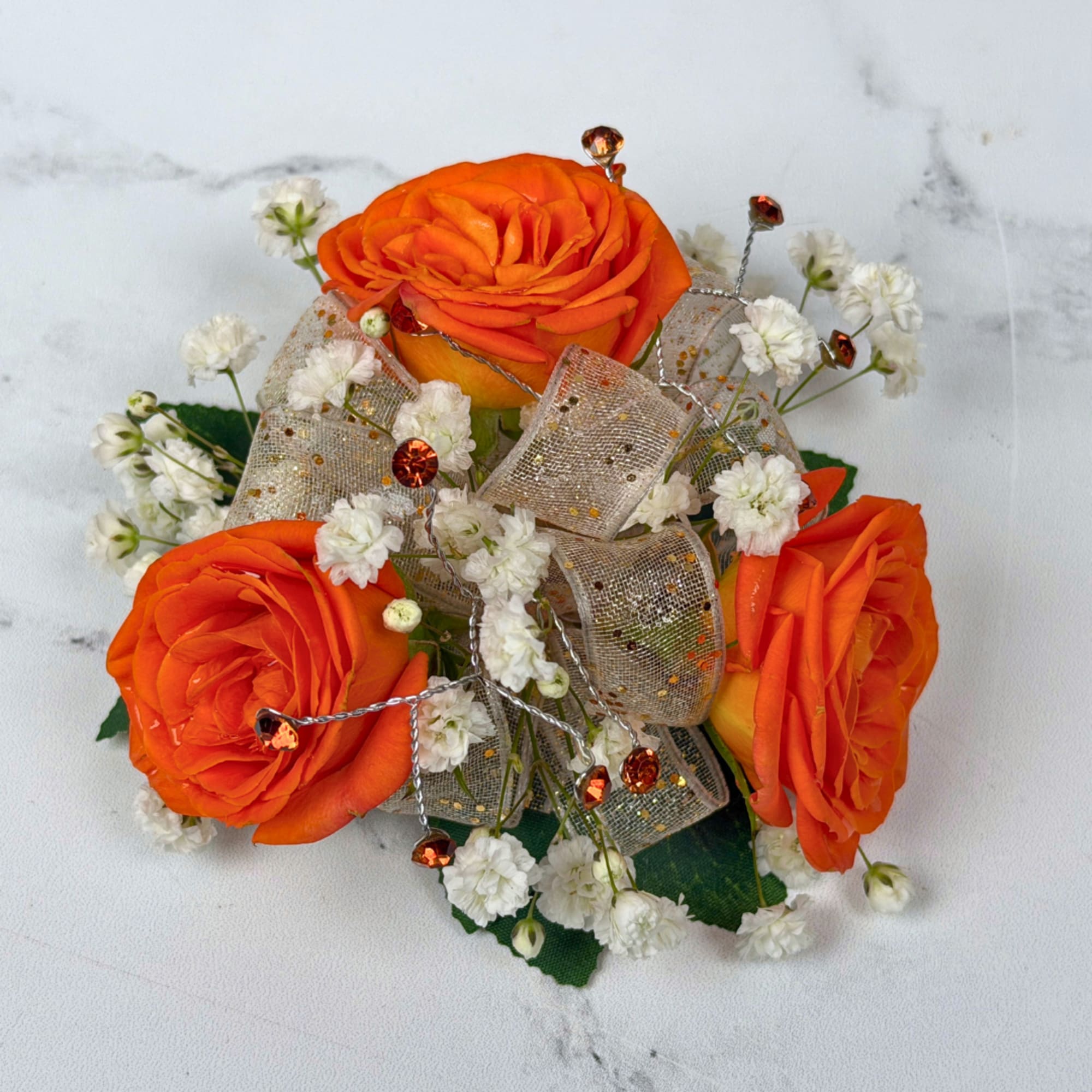 Three vivid orange roses take center stage in this version of our