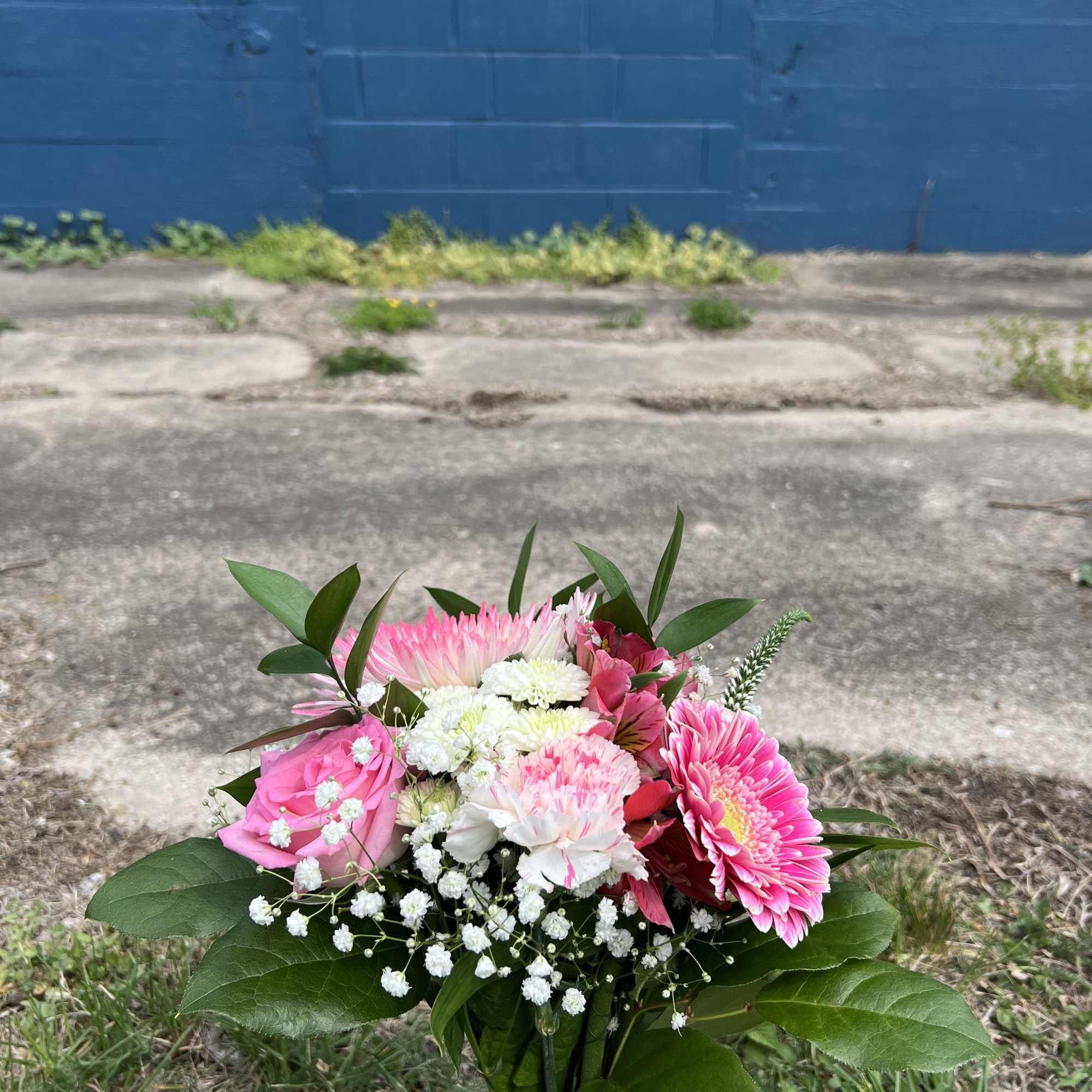 An elegant hand-tied bouquet that will compliment any prom outfit. Filled with