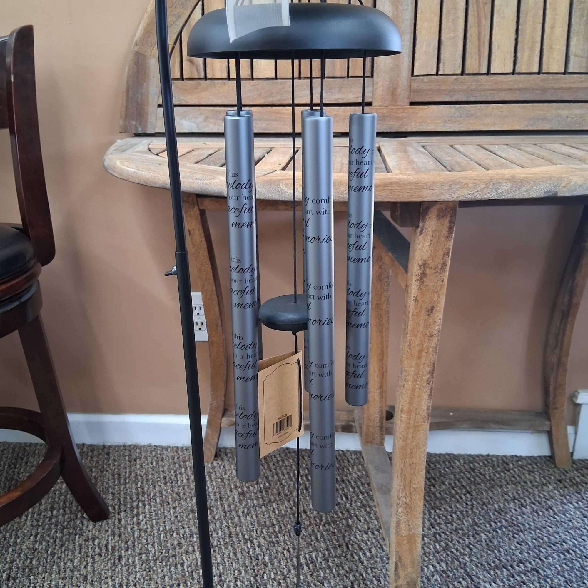 30" Wind Chime On Stand 
Cames with stand, silk greenery, and bow.
Inscription