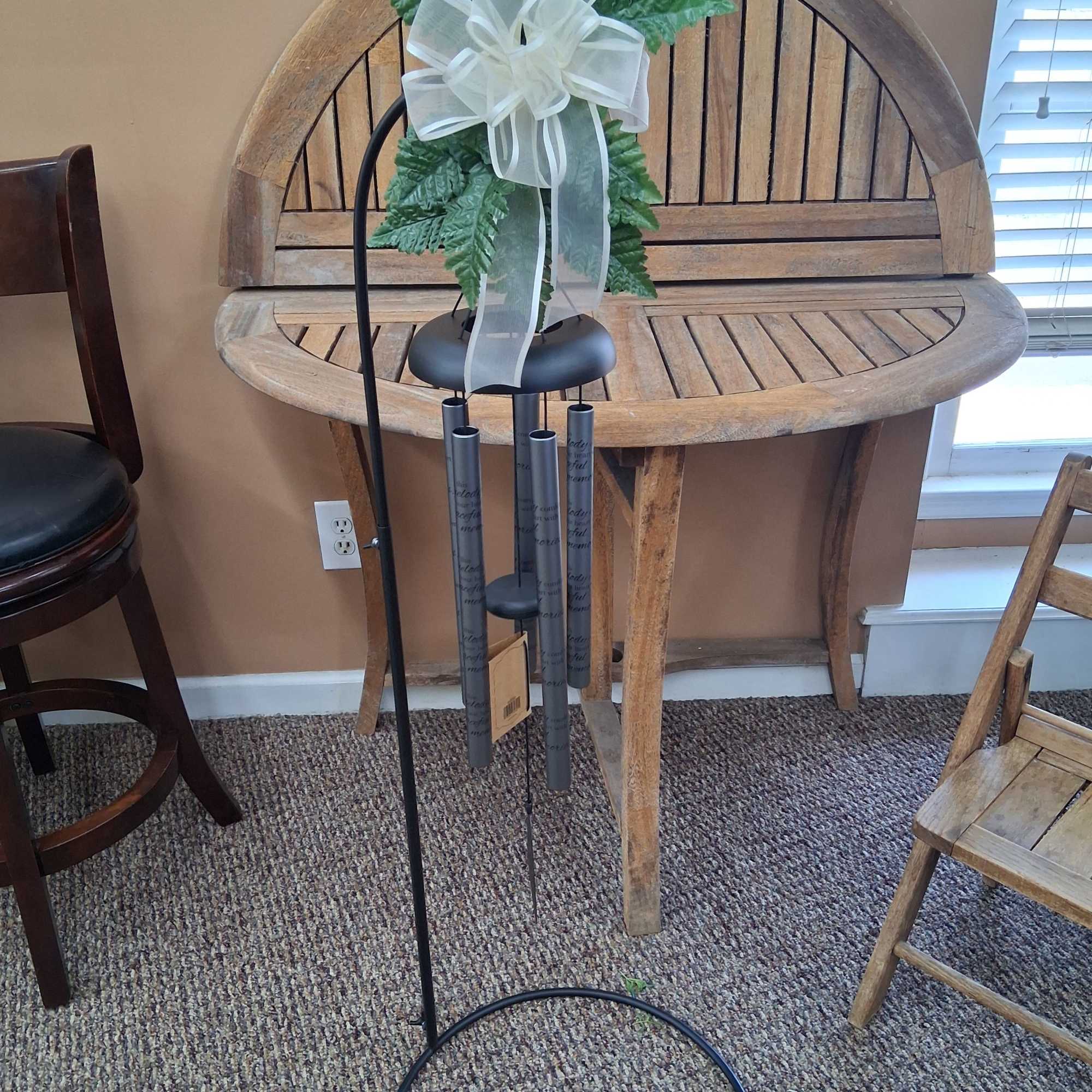 30" Wind Chime On Stand 
Cames with stand, silk greenery, and bow.
Inscription