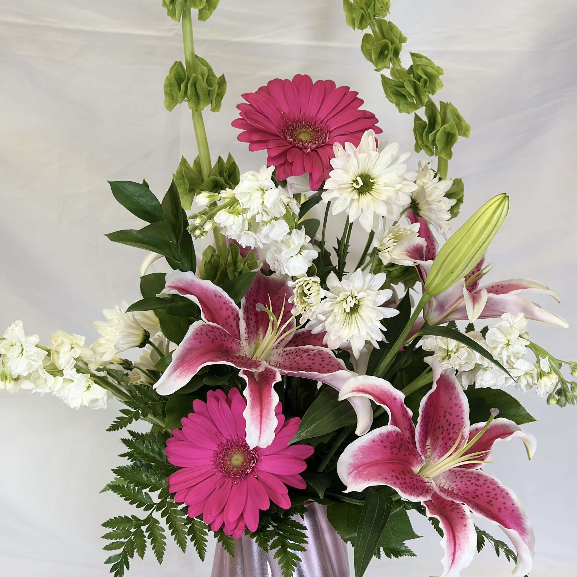 This colorful bouquet is full of fun and whimsy. The tall curling